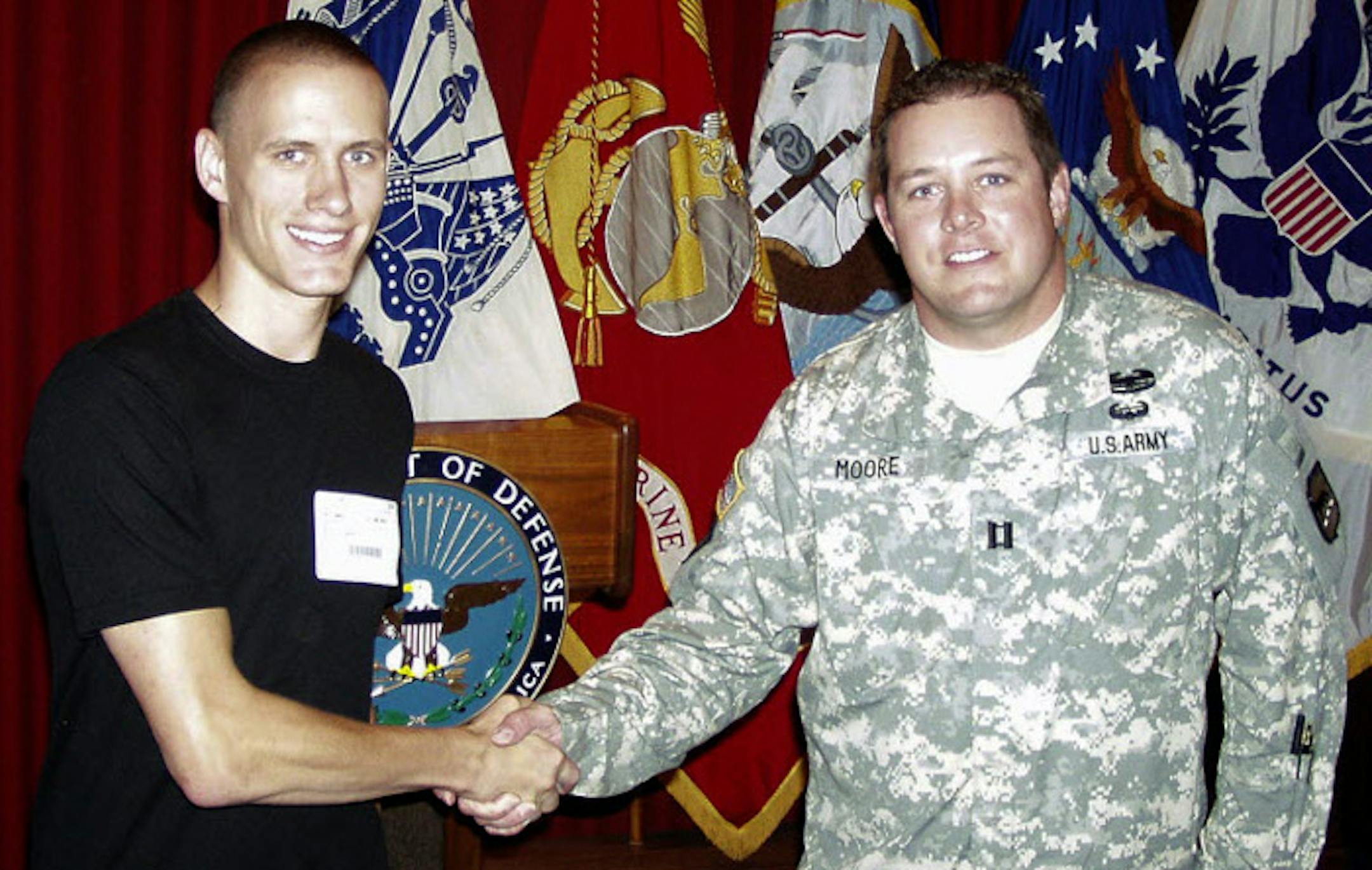 Alex Mahs of Brooklyn Park was sworn in at the Navy Military Entrance Processing station in Sioux Falls, S.D., by Army Capt. Nathan Moore.