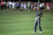 Tiger Woods shows his frustration after his last shot on the 18th fairway during the first round of the Hero World Challenge golf tournament on Thursd