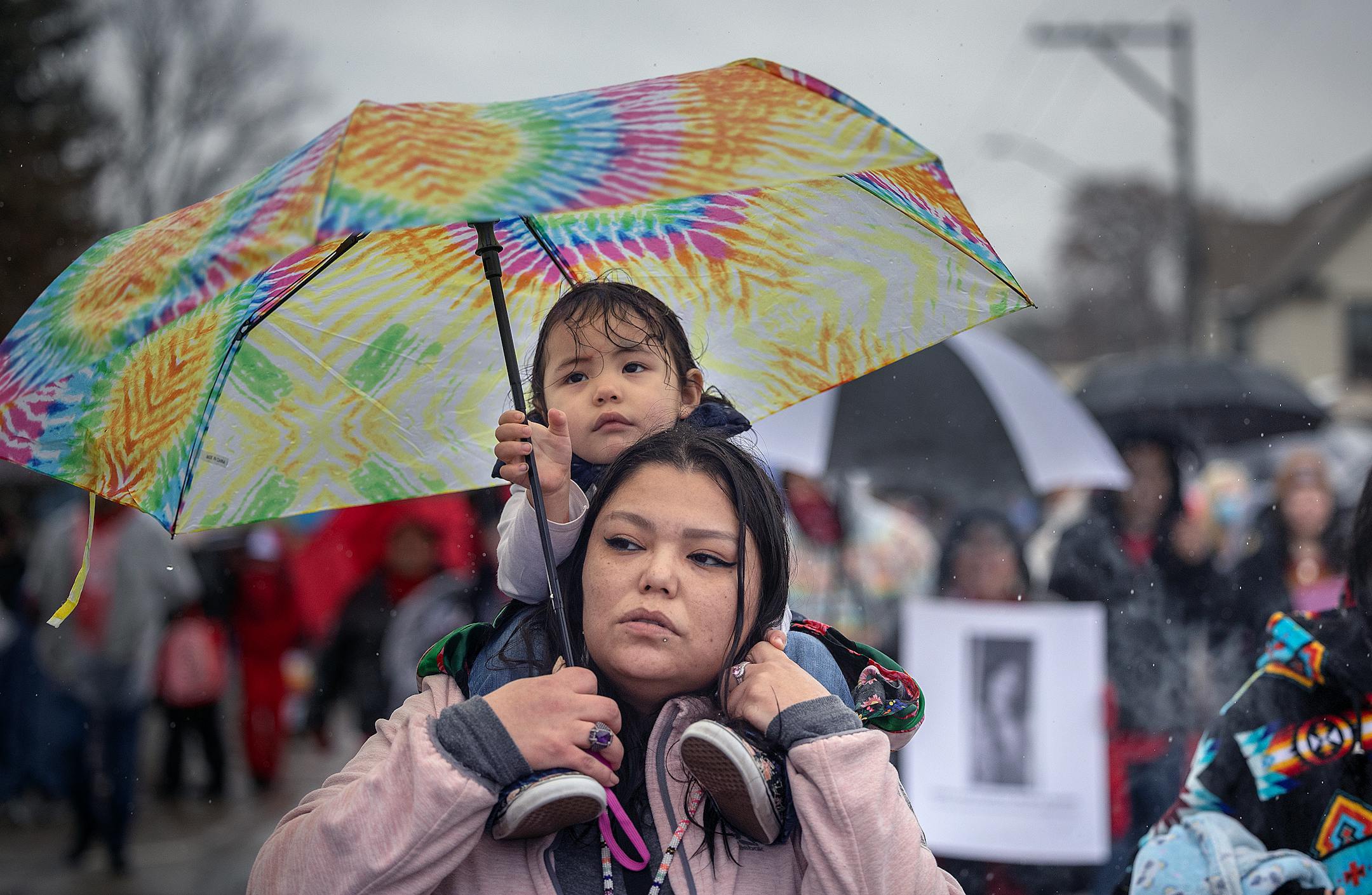 Charrise Nepoose, cq, held onto her daughter Rickians Sanford, cq, as they made their way along Bloomington Avenue during the annual Missing and Murdered Indigenous Women's rally and march at the East Phillips Park Cultural & Community Center, in Minneapolis, Minn., on Tuesday, Feb. 14, 2023.  Minnesota's movement to solve the cases of hundreds of missing and murdered Indigenous women and girls hit a milestone last year with the opening of a first-in-the-nation office tasked with systemically trying to fix the problem. Minnesota's Native women legislators reflected on where the movement goes from here during the annual Missing and Murdered Indigenous Women's march in Minneapolis.   ] Elizabeth Flores • liz.flores@startribune.com
