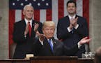 President Donald Trump gestures as delivers his first State of the Union address in the House chamber of the U.S. Capitol to a joint session of Congre