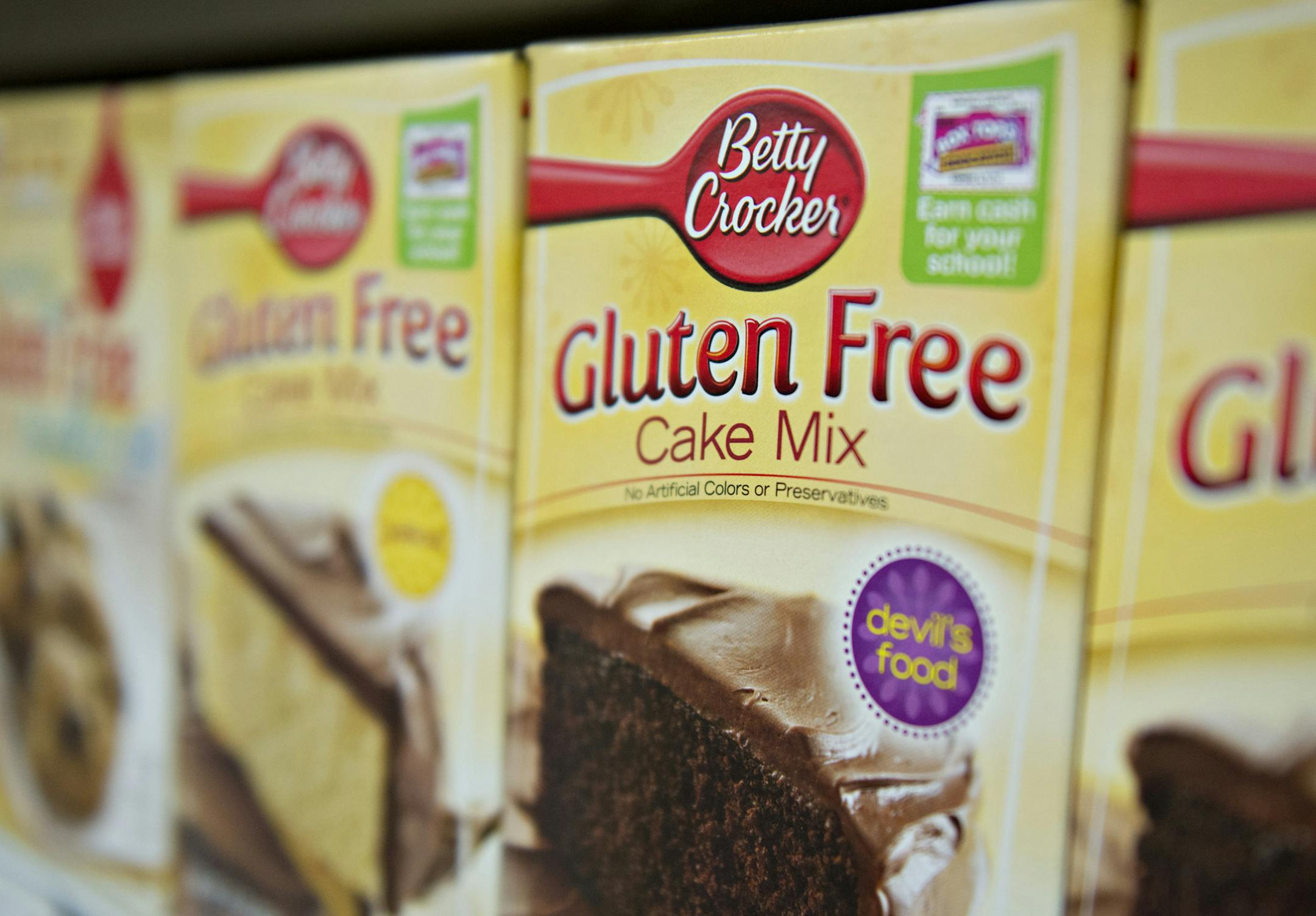 "Gluten Free" appears on the packaging for General Mills Inc. Betty Crocker brand cake mix displayed for sale at a supermarket in Princeton, Illinois, U.S., on Wednesday, Aug. 7, 2013. The Food and Drug Administration (FDA) is issuing a final rule to define the term "gluten-free" when voluntarily used in food labeling, according to a notice published in the Aug. 5 Federal Register. Photographer: Daniel Acker/Bloomberg ORG XMIT: 175936975