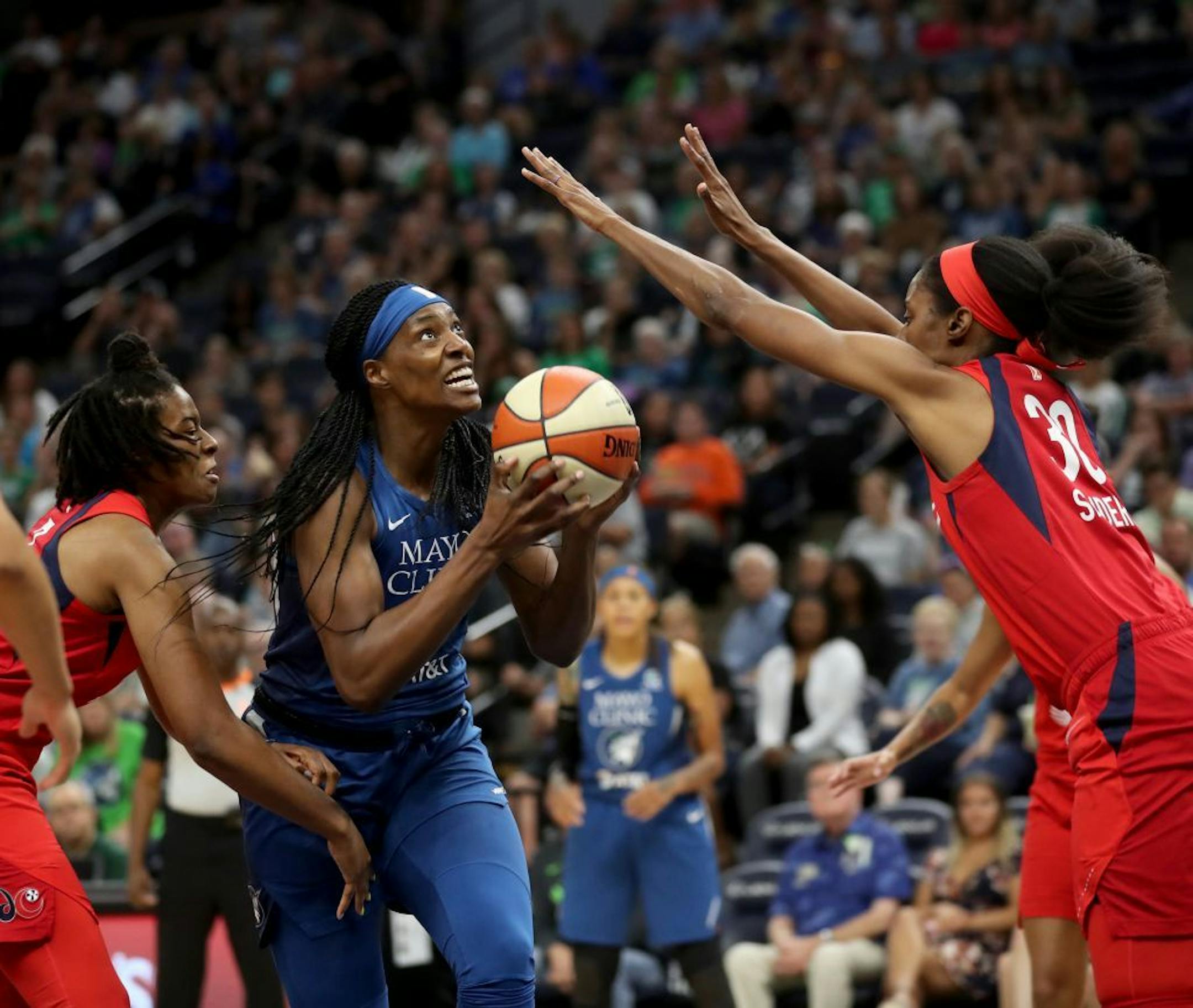 The Minnesota Lynx's Sylvia Fowles (34) drives on the Washington Mystics' Latoya Sanders (30) during the first half of the Lynx game Friday, Aug. 16, 2019, at the Target Center in Minneapolis, MN.
