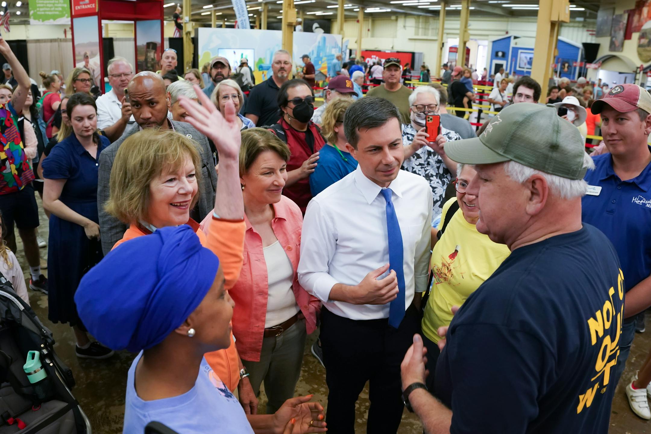 U.S. Transportation Secretary Pete Buttigieg greeted Governor Tim Walz as he toured with Minnesota State Fair with Rep. Ilhan Omar, Sen. Tina Smith and Sen. Amy Klobuchar Thursday, Aug. 25, 2022, Falcon Heights, Minn.
