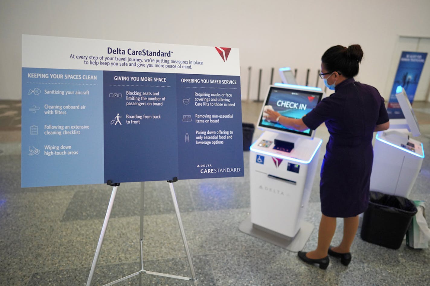 Amy Nelson disinfects a check-in kiosk after it was used by a passenger. Delta shows off its new cleanliness procedures at MSP. brian.peterson@startribune.com Minneapolis, MN Monday, June 15, 2020