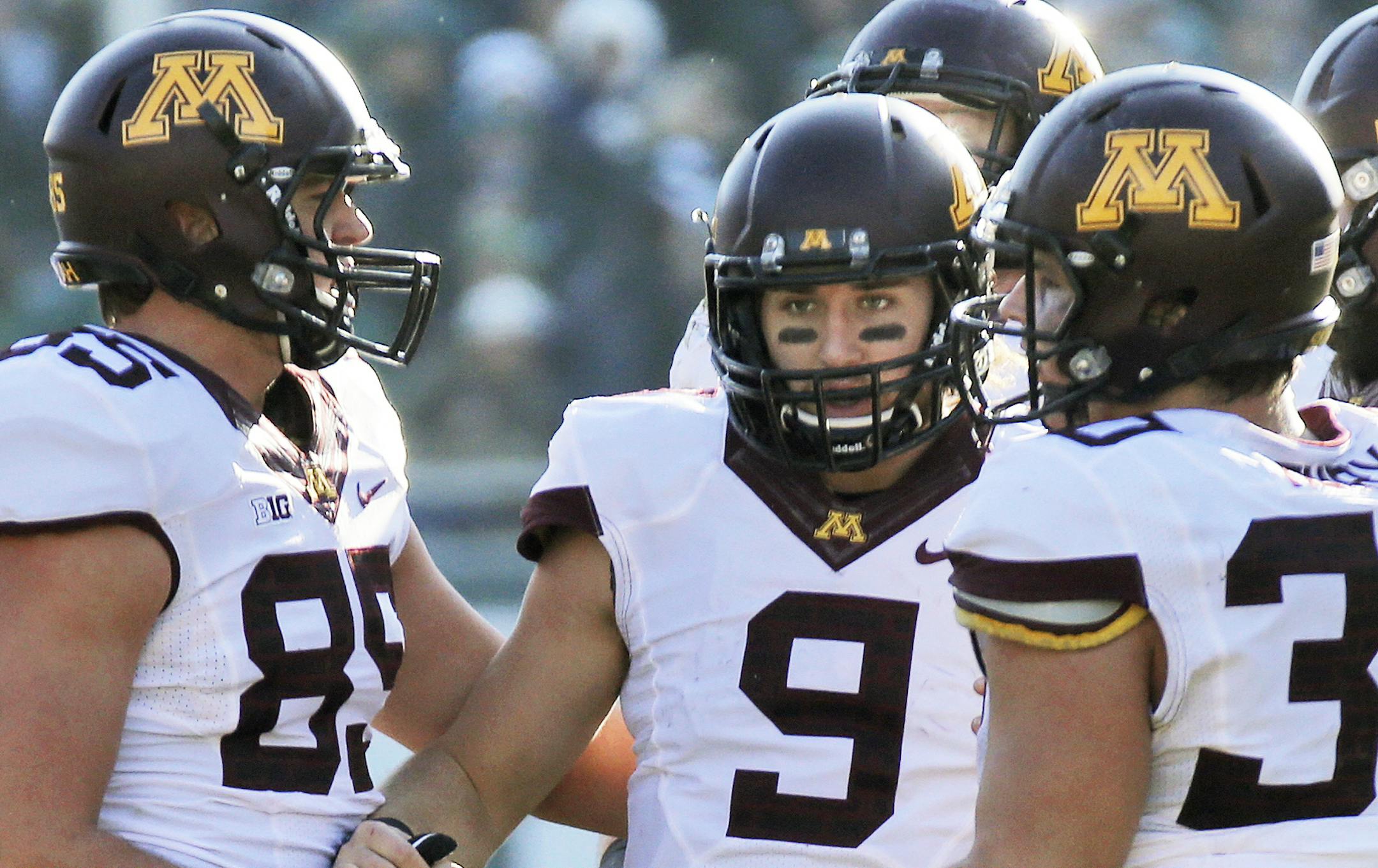 Minnesota Gophers vs. Michigan State Spartans. Michigan State won 14-3. Minnesota teammates helped quarterback Philip Nelson (9) gain his balance after being hit by Spartan defensive rushers. Nelson left the game with concussion-like symptons. (MARLIN LEVISON/STARTRIBUNE(mlevison@startribune.com)