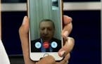 In an image taken from video posted on YouTube, Turkey's president vowed to fight against the attempted military coup of the country via a smartphone 