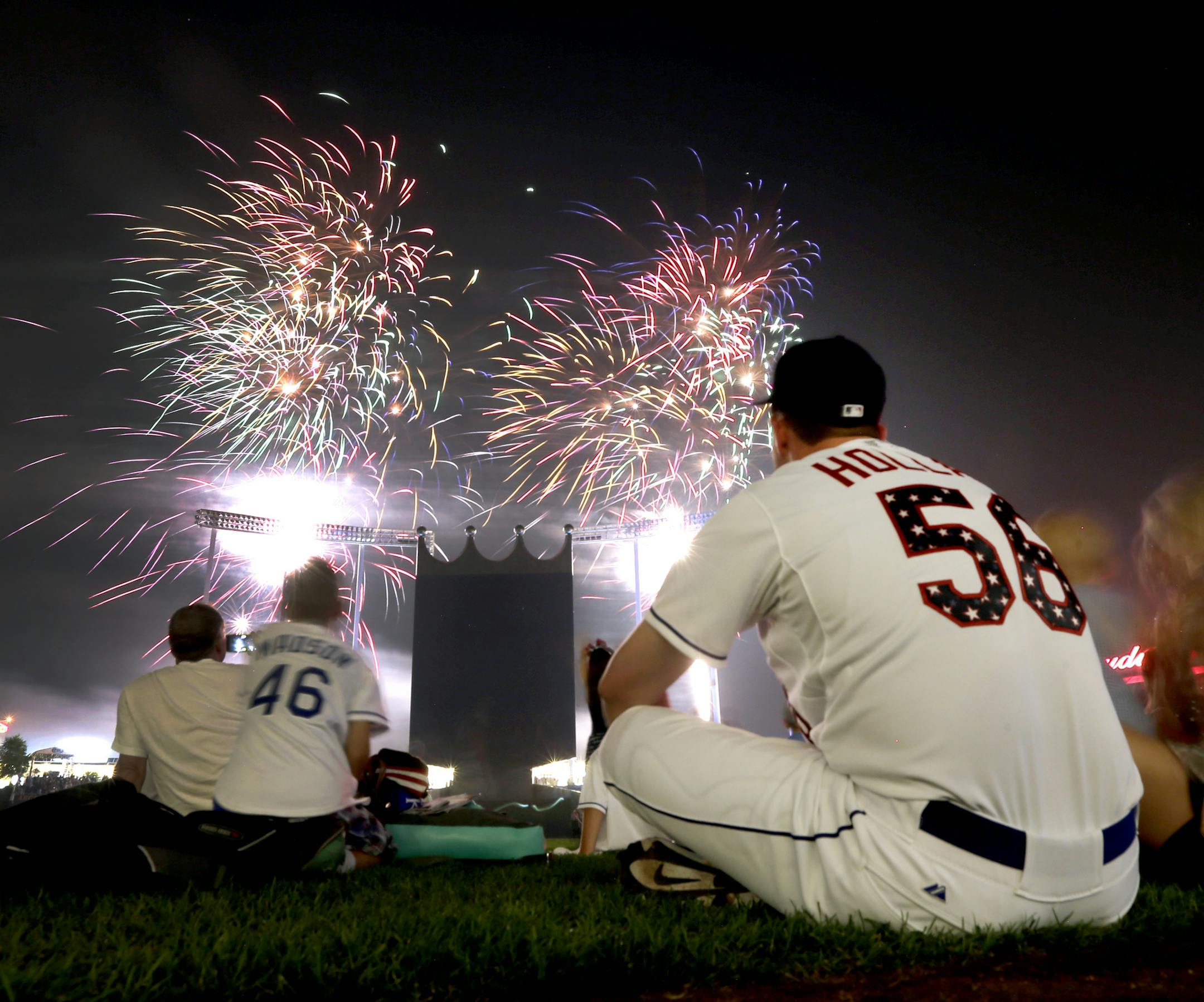 Kansas City Royals relief pitcher Greg Holland (56) watches Fourth of July fireworks on the field after a baseball game against the Minnesota Twins on Saturday, July 4, 2015, in Kansas City, Mo. The Twins won 5-3. (AP Photo/Charlie Riedel)