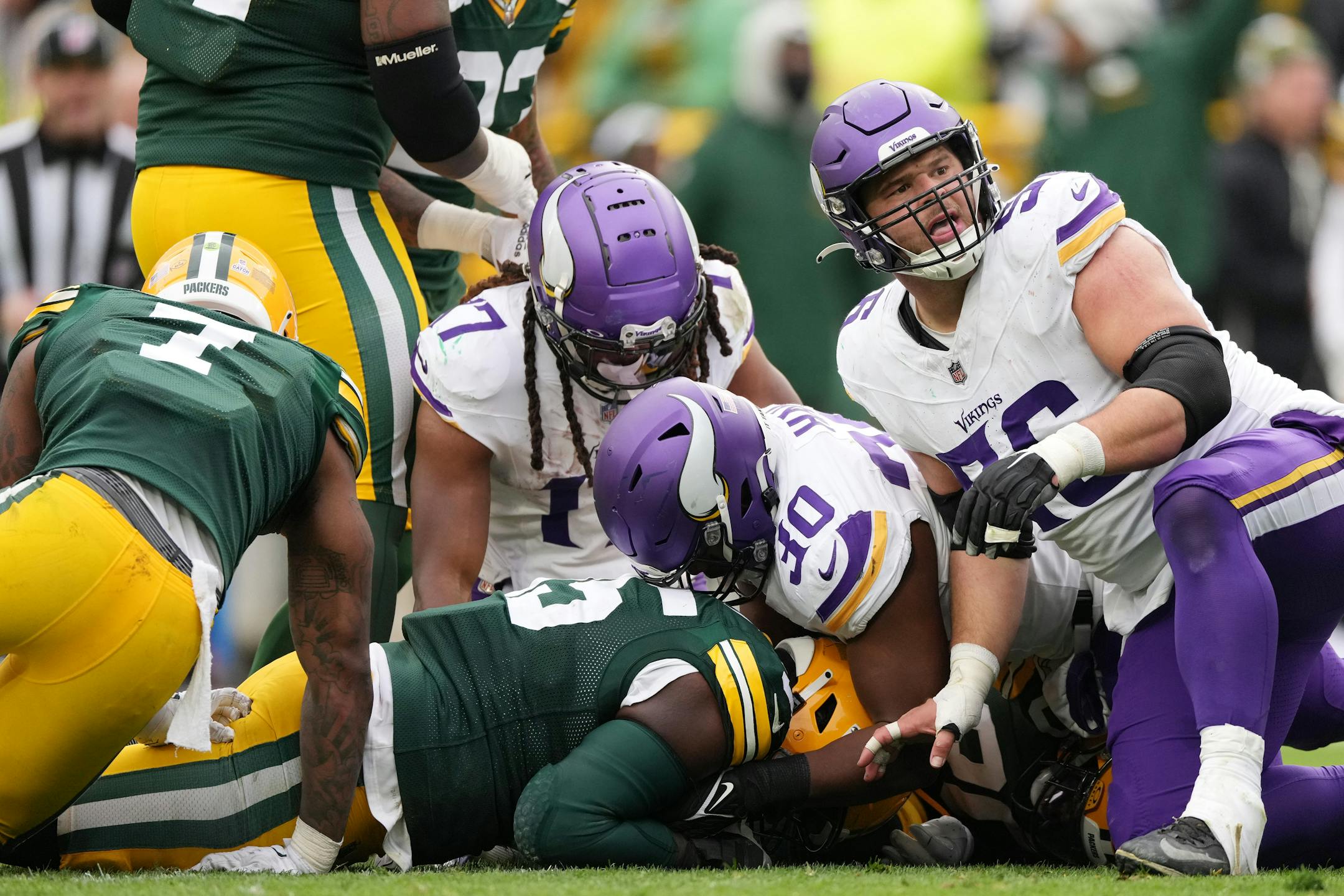 Minnesota Vikings center Garrett Bradbury (56) looks up after the strip sack on Minnesota Vikings quarterback Jaren Hall (16) resulted in a turnover in the fourth quarter of an NFL game between the Minnesota Vikings and the Green Bay Packers Sunday, Oct. 29, 2023 at Lambeau Field in Green Bay, Wis. ] ANTHONY SOUFFLE • anthony.souffle@startribune.com