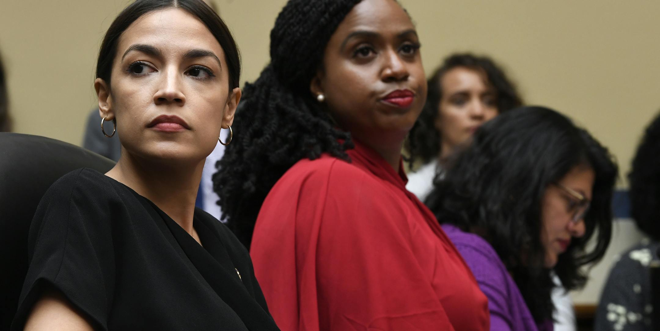Rep. Alexandria Ocasio-Cortez, D-N.Y., left, Rep. Ayanna Pressley, D-Mass., center, and Rep. Rashida Tlaib, D-Mich., right, attend a House Oversight Committee hearing on Capitol Hill in Washington, Monday, July 15, 2019, on White House counselor Kellyanne Conway's violation of the Hatch Act. (AP Photo/Susan Walsh)