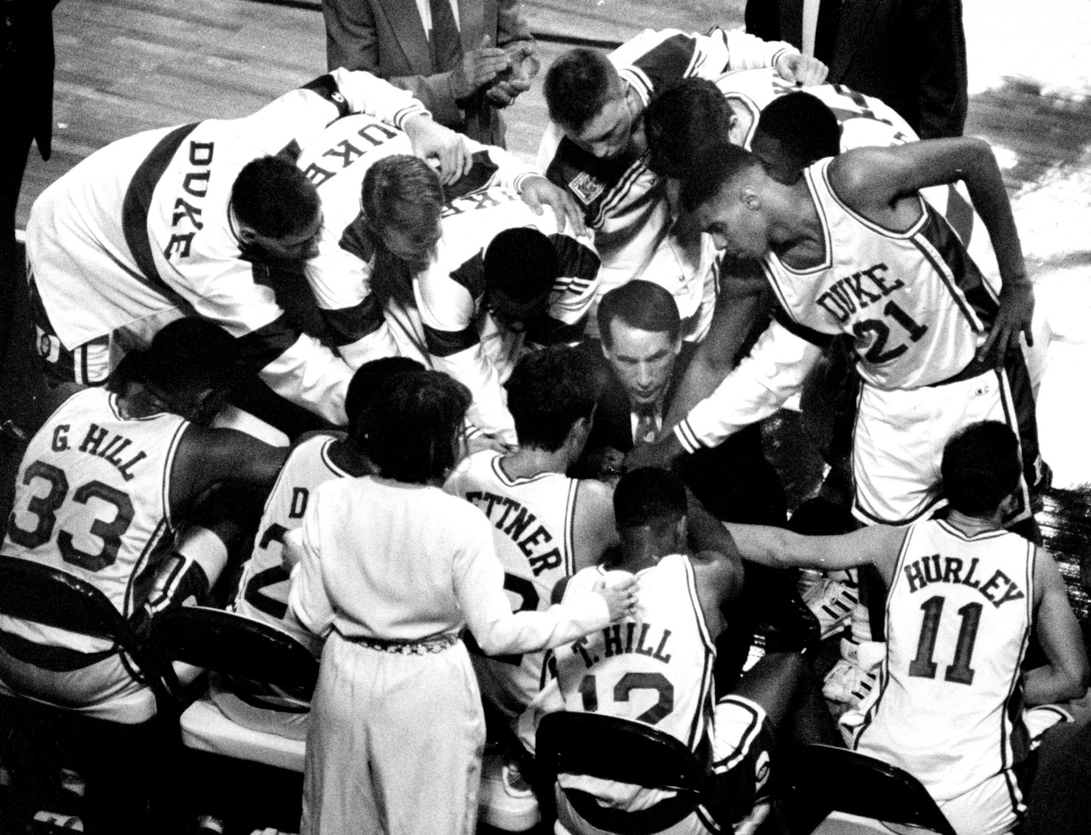 Duke coach Mike Krzyzewski, with the starting five seated, huddled with his team prior to their Final Four game against Indiana. (Jerry Holt/Star Tribune)