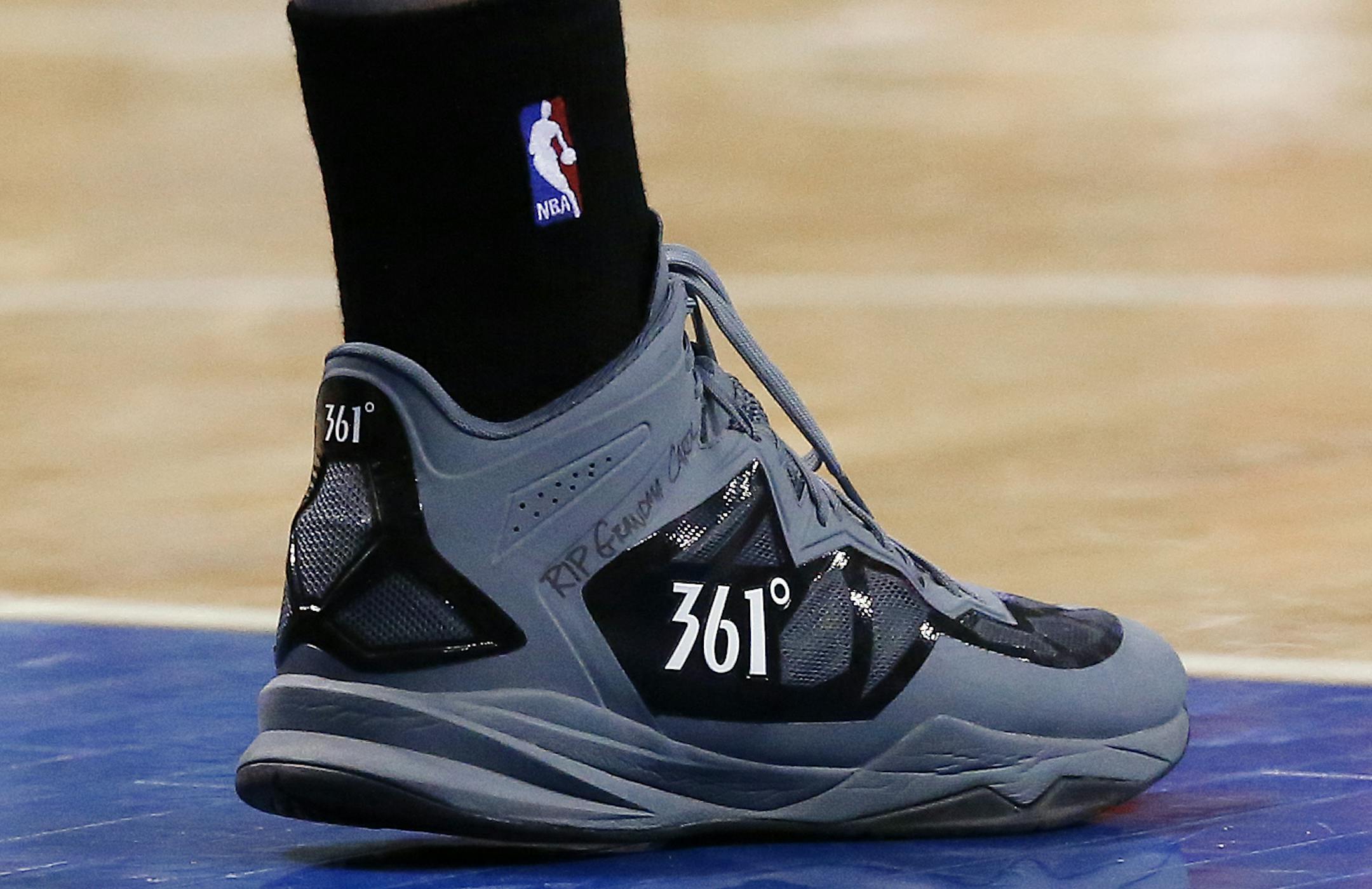 Minnesota Timberwolves power forward Kevin Love wears RIP Grandma Carol on his basketball shoe against the Detroit Pistons in the first half of an NBA basketball game in Auburn Hills, Mich., Tuesday, Dec. 10, 2013. Love's grandmother Carol Lee Craig died Wednesday, Dec. 4. (AP Photo/Paul Sancya)
