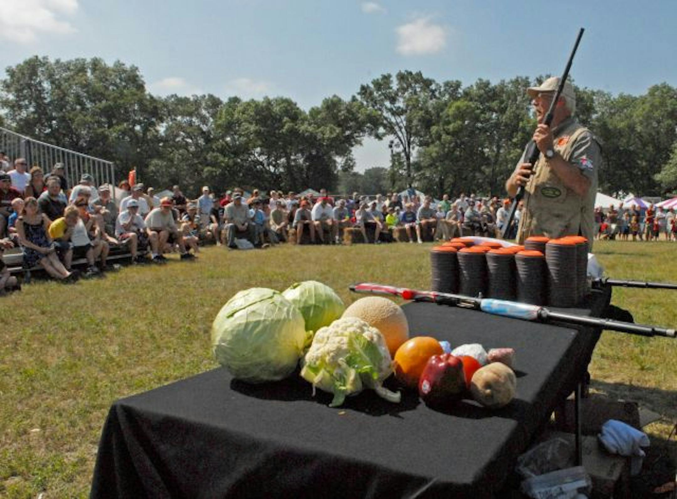 Salad anyone? Tom Knapp uses a variety of props, and shoots at a variety of targets, at his Game Fair show in Anoka.