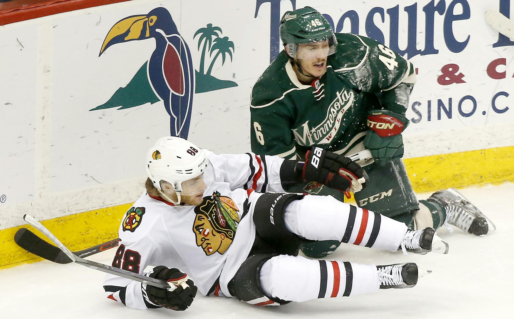 Patrick Kane (88) and Jared Spurgeon (46) fell to the ice in the first period. ] CARLOS GONZALEZ cgonzalez@startribune.com, May 7, 2015, St. Paul, MN, Xcel Energy Center, NHL, Minnesota Wild vs. Chicago Blackhawks, Game 4, Stanley Cup Playoffs, Round 2