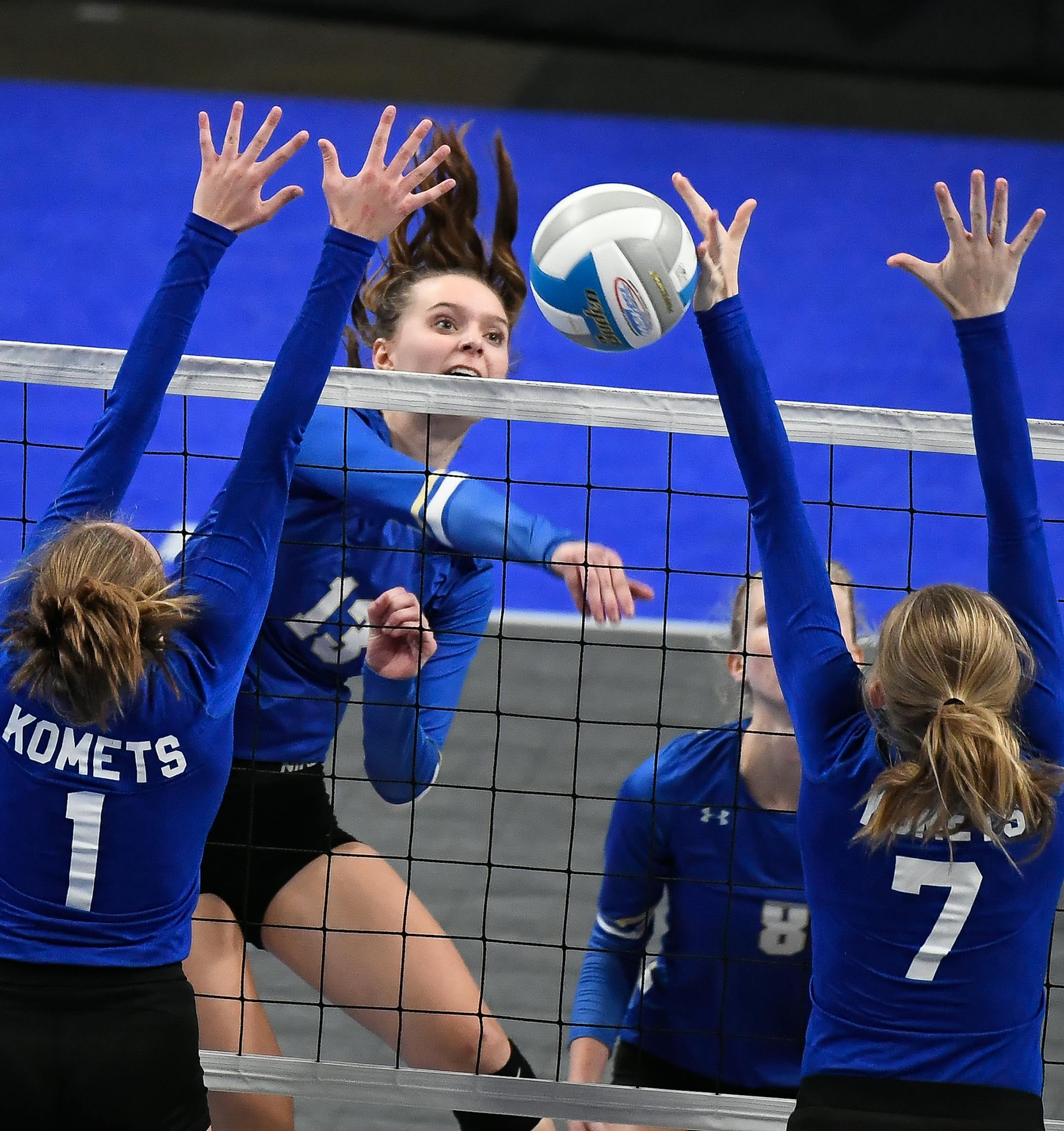Marie LaFrance (13) of Academy of Holy Angels spiked the ball past Caroline Braun (1) of Kasson-Mantorville High School and McKenzie Evans (7) in the third set Thursday. ] AARON LAVINSKY ï aaron.lavinsky@startribune.com Maple Lake played Kenyon-Wanamingo and Holy Angels played Kasson-Mantorville in the Class 2A quarterfinals of the high school state tournament on Thursday, Nov. 9, 2017 at Xcel Energy Center in St. Paul, Minn.