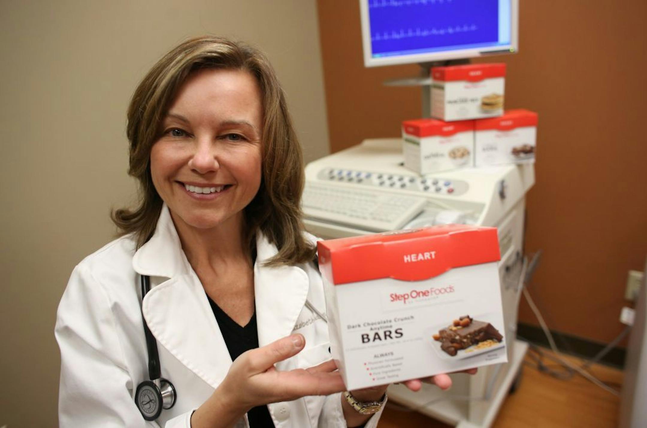 Edina cardiologist Dr. Elizabeth Klodas, a specialist in heart disease prevention, sat with a a new food product line that she helped designed called Step One Foods at her office in Edina Wednesday, February 26, 2014.