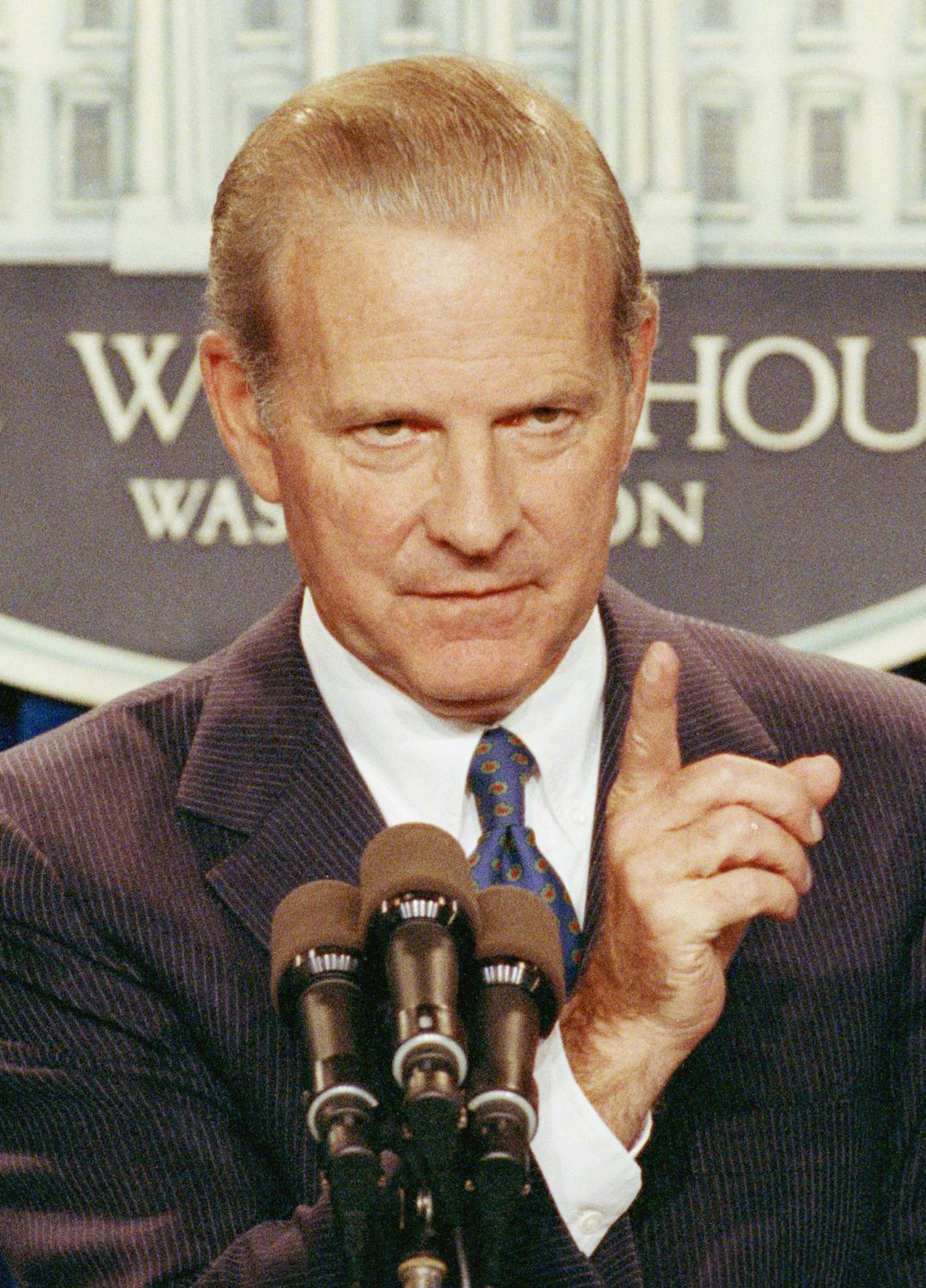 Secretary of State James Baker gestures during a news conference, Wednesday, Nov. 14, 1990 at the White House in Washington. During the press conference, Baker said the administration had not decided to use force in the Persian Gulf, but wanted that option to be credible in hopes of persuading Iraq President Saddam Hussein to give up Kuwait. Baker is to travel to three African countries this weekend to seek support authorizing the use of force. (AP Photo/Doug Mills) ORG XMIT: APHS251099