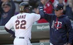 The Twins' Miguel Sano was greeted by manager Paul Molitor after scoring a run against the Kansas City Royals at Target Field in April.