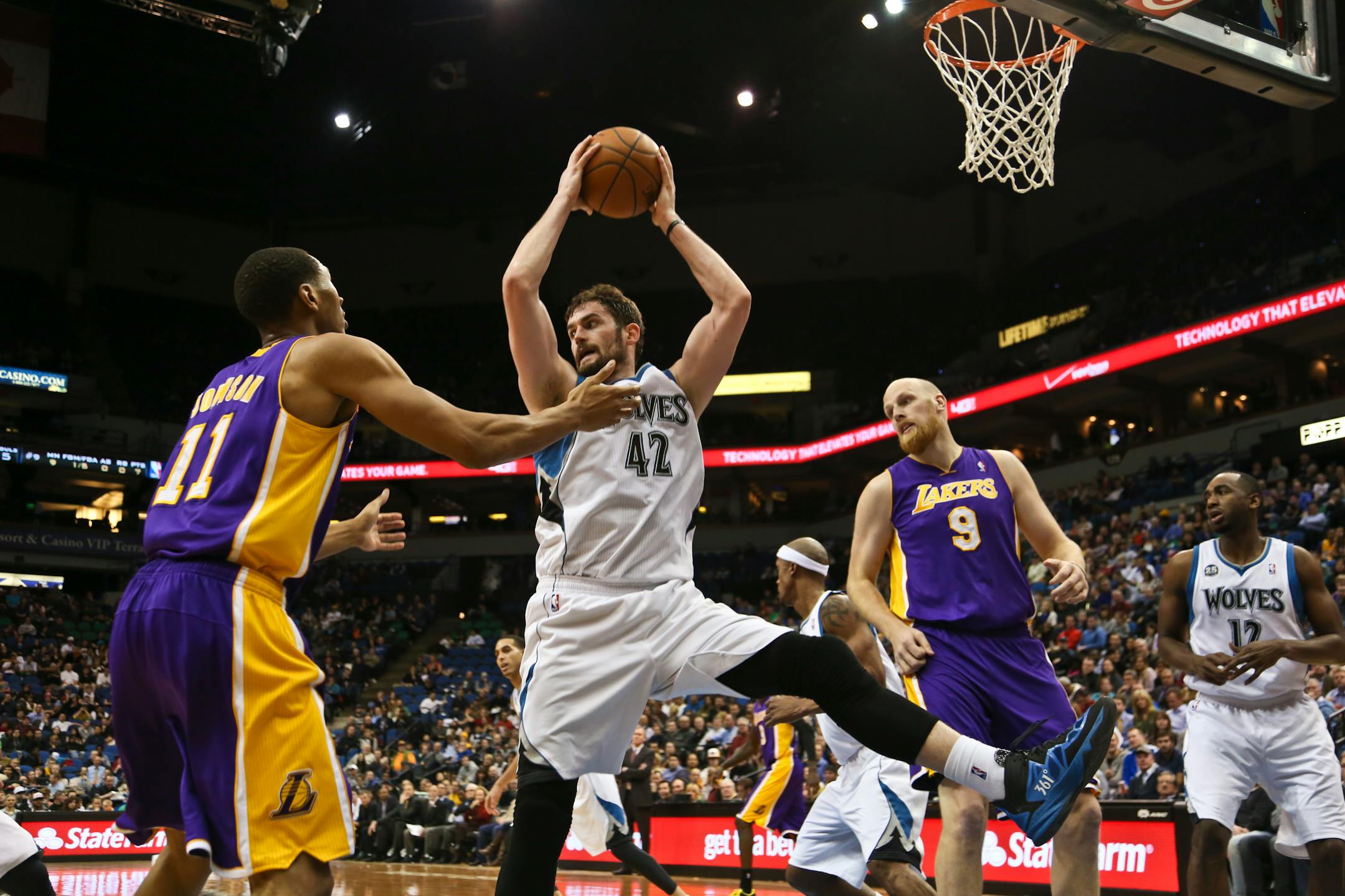 Kevin Love rebounded the ball in the second half during an NBA game between the Timberwolves and the L.A. Lakers at Target Center on Tuesday, February 4, 2014.