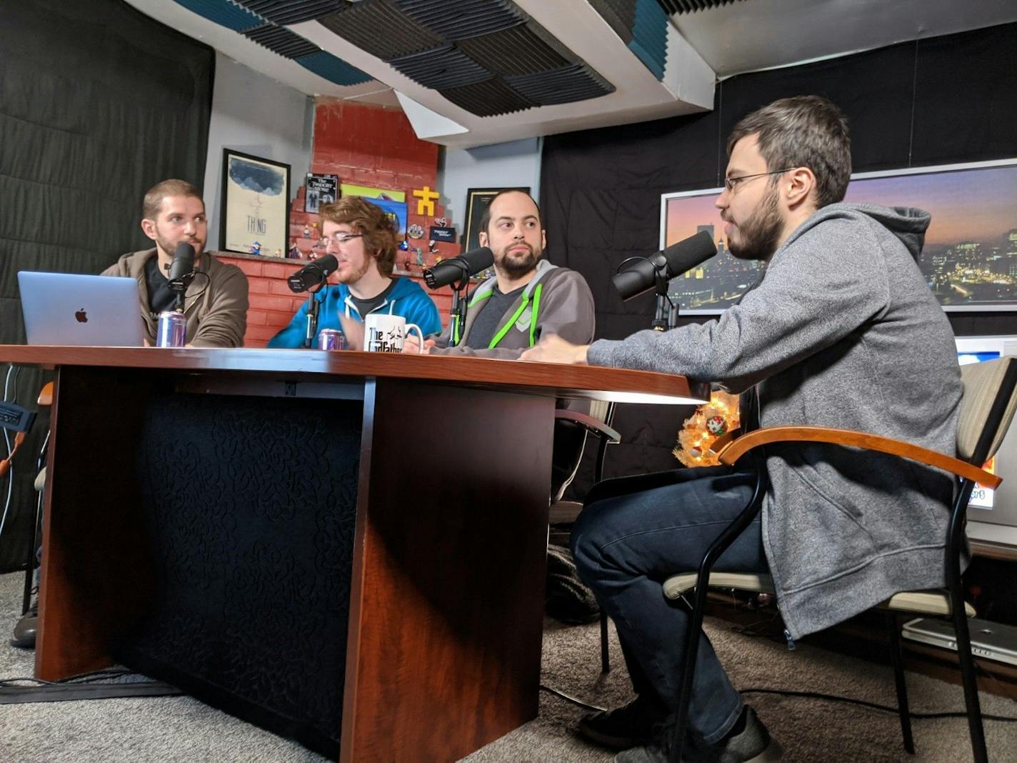 Former "Game Informer" employees [from left] Ben Hanson, Kyle Hilliard, Jeff Marchiafava and Suriel Vazquez record their weekly gaming podcast "The MinnMax Show" in Hanson's basement.
Photo by Nicole Norfleet