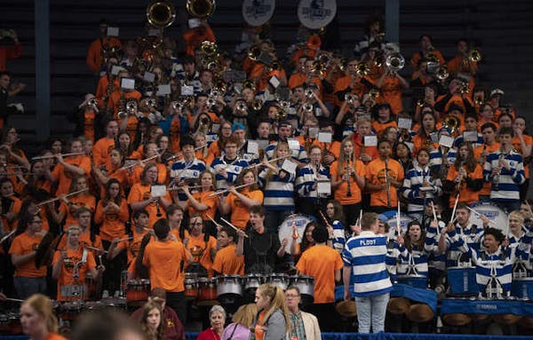 On what proved to be the last night of the girls' basketball state tournament on March 12, the combined Hopkins and Farmington bands played several tu