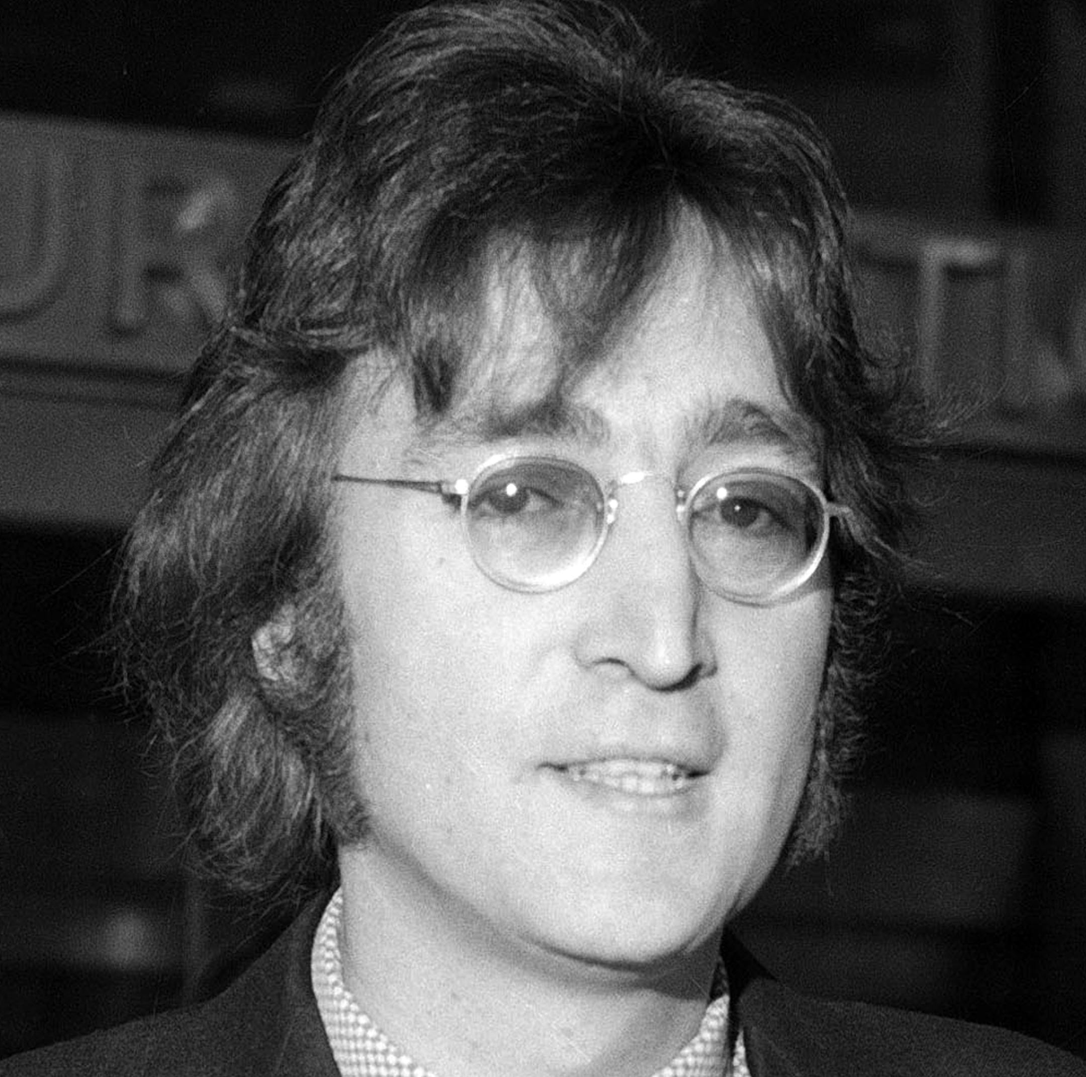 FILE - In this March 16, 1972 file photo, John Lennon leaves a deportation hearing at the offices of the Department of Immigration and Naturalization in New York. Lennonís 75th birthday will be celebrated next month in New York City at a concert featuring Willie Nelson, the Roots, Steven Tyler and Sheryl Crow. Event producer Blackbird Presents announced Friday that the show will tape at The Theater at Madison Square Garden on Dec. 5, 2015. It will air on AMC on Dec. 19. (AP Photo/Tony Camer