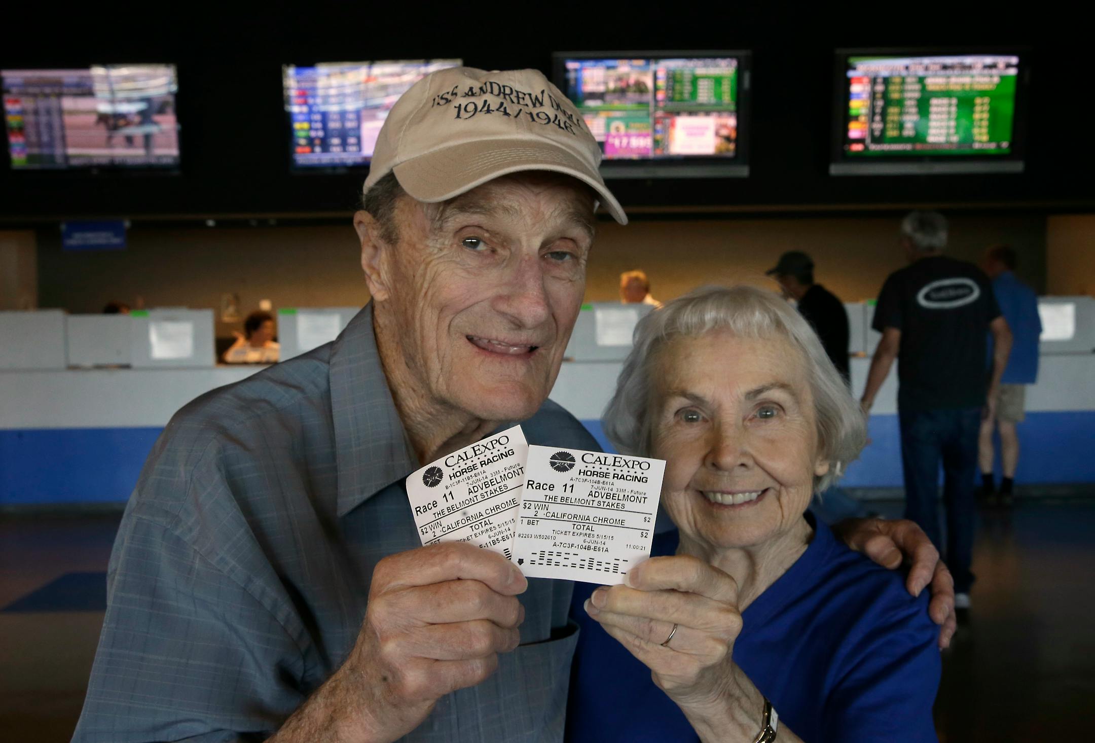 Harold Walter and his wife, Catherine, display their $2 advance wagers they placed on California Chrome, at the CalExpo racetrack in Sacramento,Calif. California Chrome, the Kentucky Derby and Preakness Stakes winner, will attempt to become the first Triple Crown winner since Affirmed in 1978.