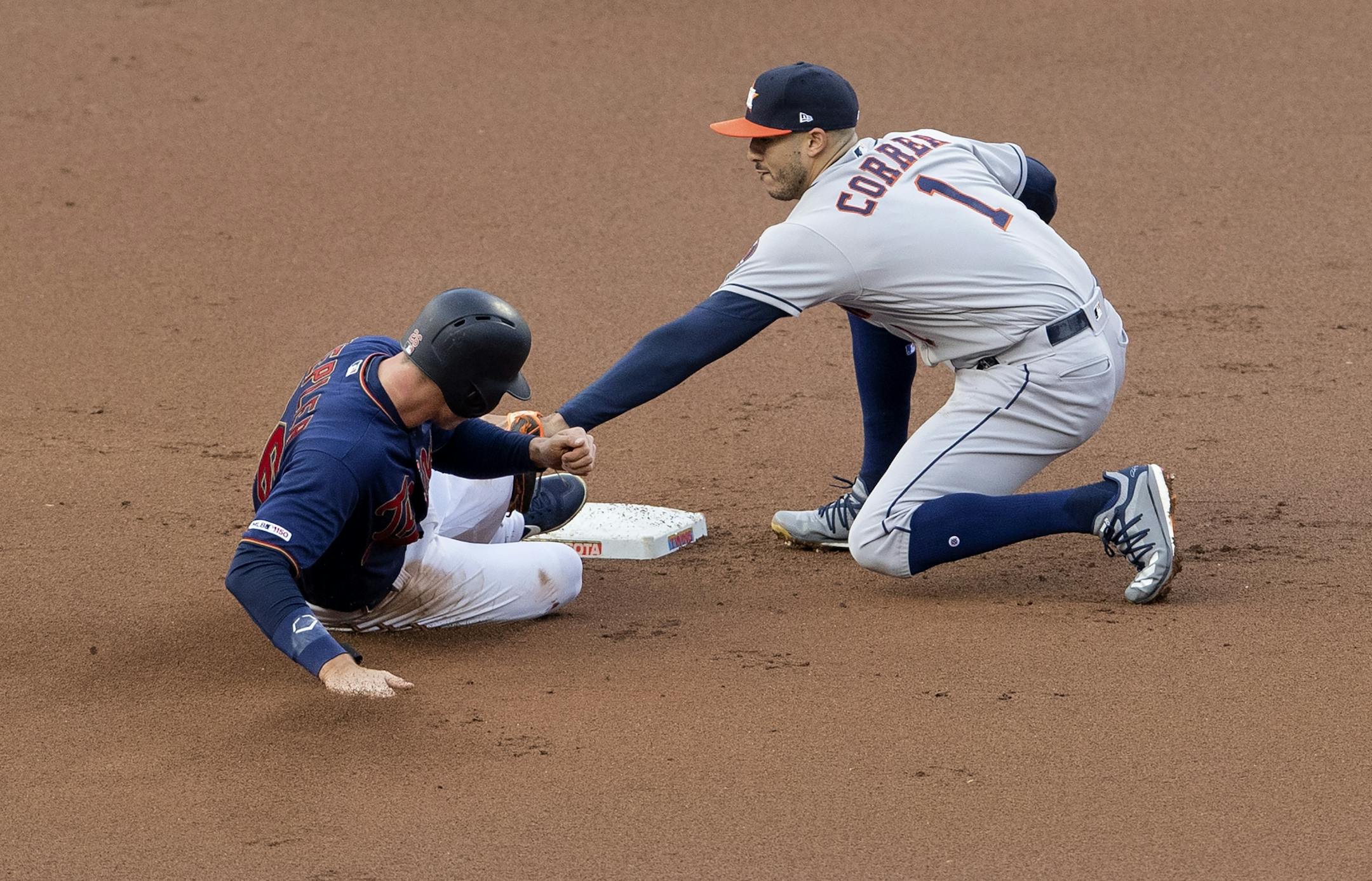 Minnesota Twins Max Kepler was tagged out at second base by Houston Astros Carlos Correa on a fiuelder choice in the first inning.