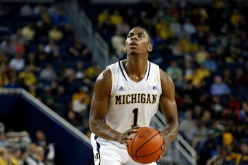 Michigan Wolverines forward Glenn Robinson III shoots against Wayne State in the first half of an exhibition NCAA basketball game in Ann Arbor, Mich.,