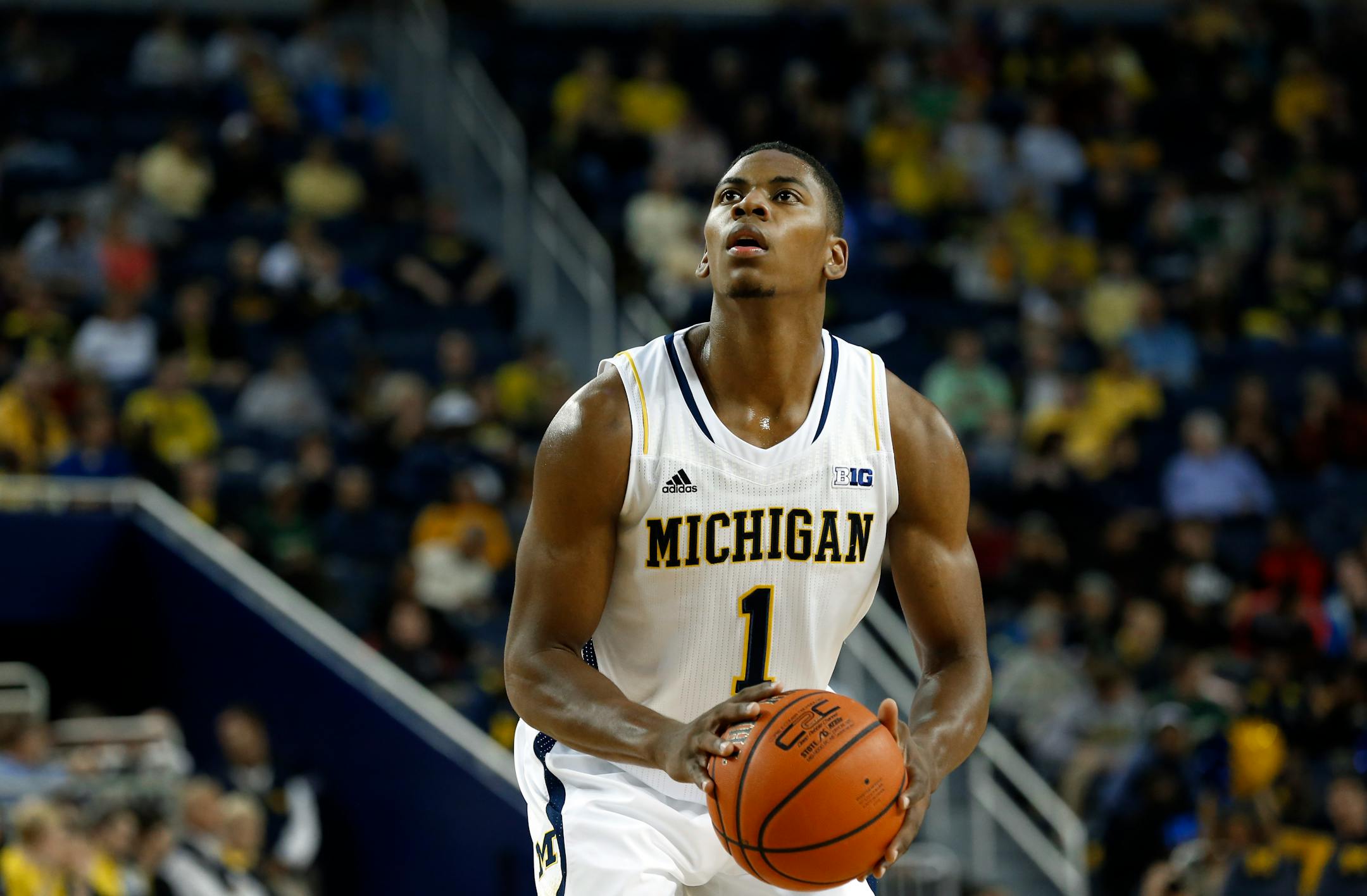 Michigan Wolverines forward Glenn Robinson III shoots against Wayne State in the first half of an exhibition NCAA basketball game in Ann Arbor, Mich., Monday, Nov. 4, 2013. (AP Photo/Paul Sancya)