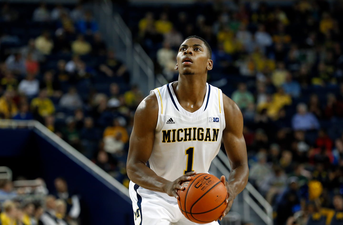 Michigan Wolverines forward Glenn Robinson III shoots against Wayne State in the first half of an exhibition NCAA basketball game in Ann Arbor, Mich., Monday, Nov. 4, 2013. (AP Photo/Paul Sancya)