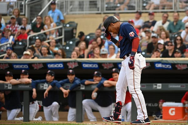 Minnesota Twins second baseman Jorge Polanco (11) reacted after he was struck out in the bottom of the first inning against the Cleveland Indians.