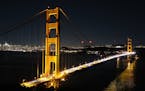 The Golden Gate Bridge at night, with San Francisco in the distance, is seen from Battery Spencer near the Marin Headlands of Marin County, Calif. Pho