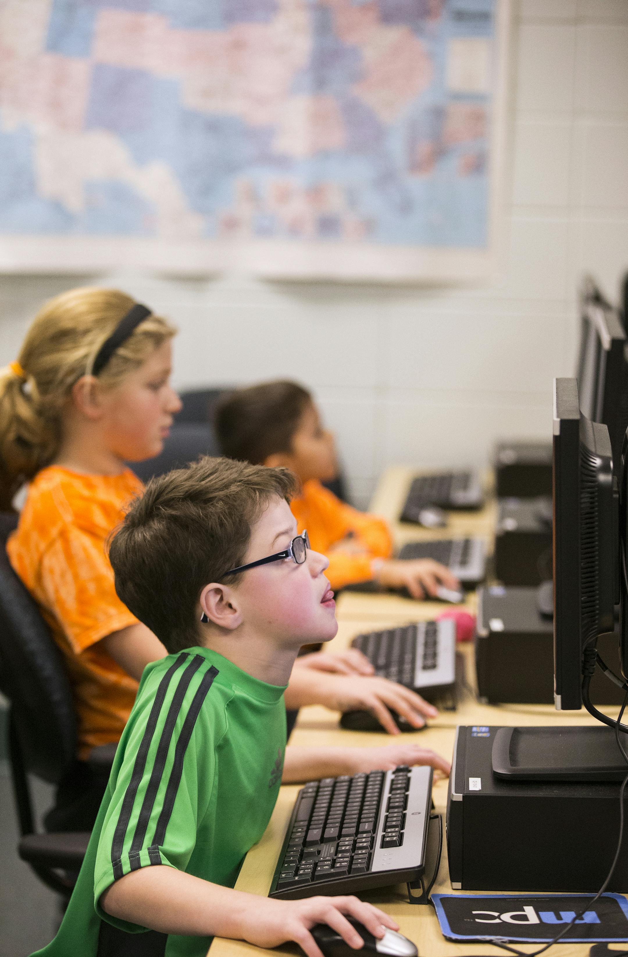 Fourth grader Josiah Meeker plays games on the computer during Kids Connection, an afterschool program at Meadowview Elementary School in Farmington on Tuesday, February 23, 2016. ] (Leila Navidi/Star Tribune) leila.navidi@startribune.com BACKGROUND INFORMATION: he Farmington district's flex days -- planned days when students work from home on district-provided iPads instead of coming into school -- have drawn national attention for their innovative use of technology and ability to save money. B