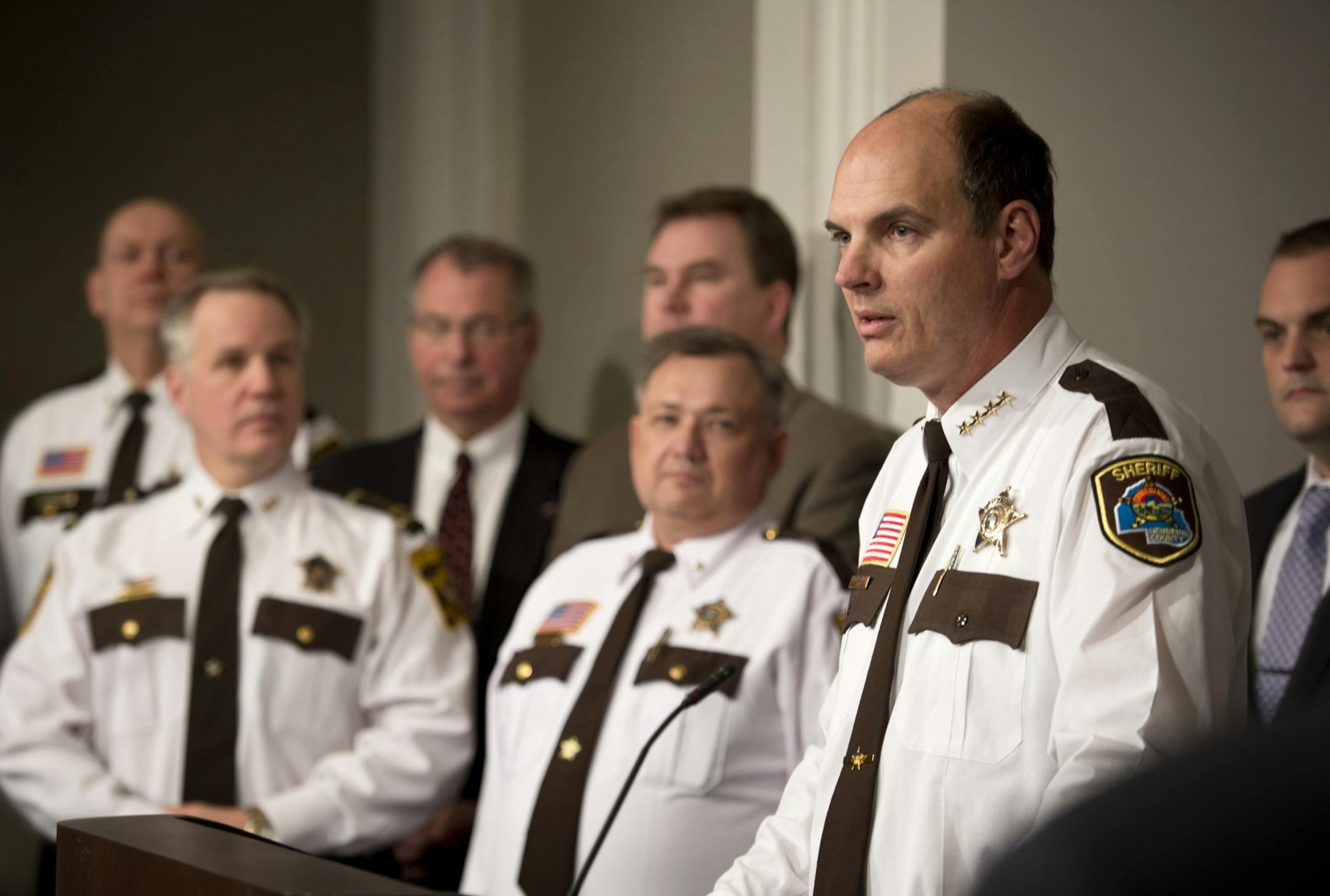 Hennepin County Sheriff Rich Stanek, right, sheriffs from surrounding counties as well as legislators and prosecutors and others came to the Capitol to discuss strengthening gun background check laws and providing greater access to mental health records for law enforcement, and addressing gaps in providing services to Minnesotans with mental illness