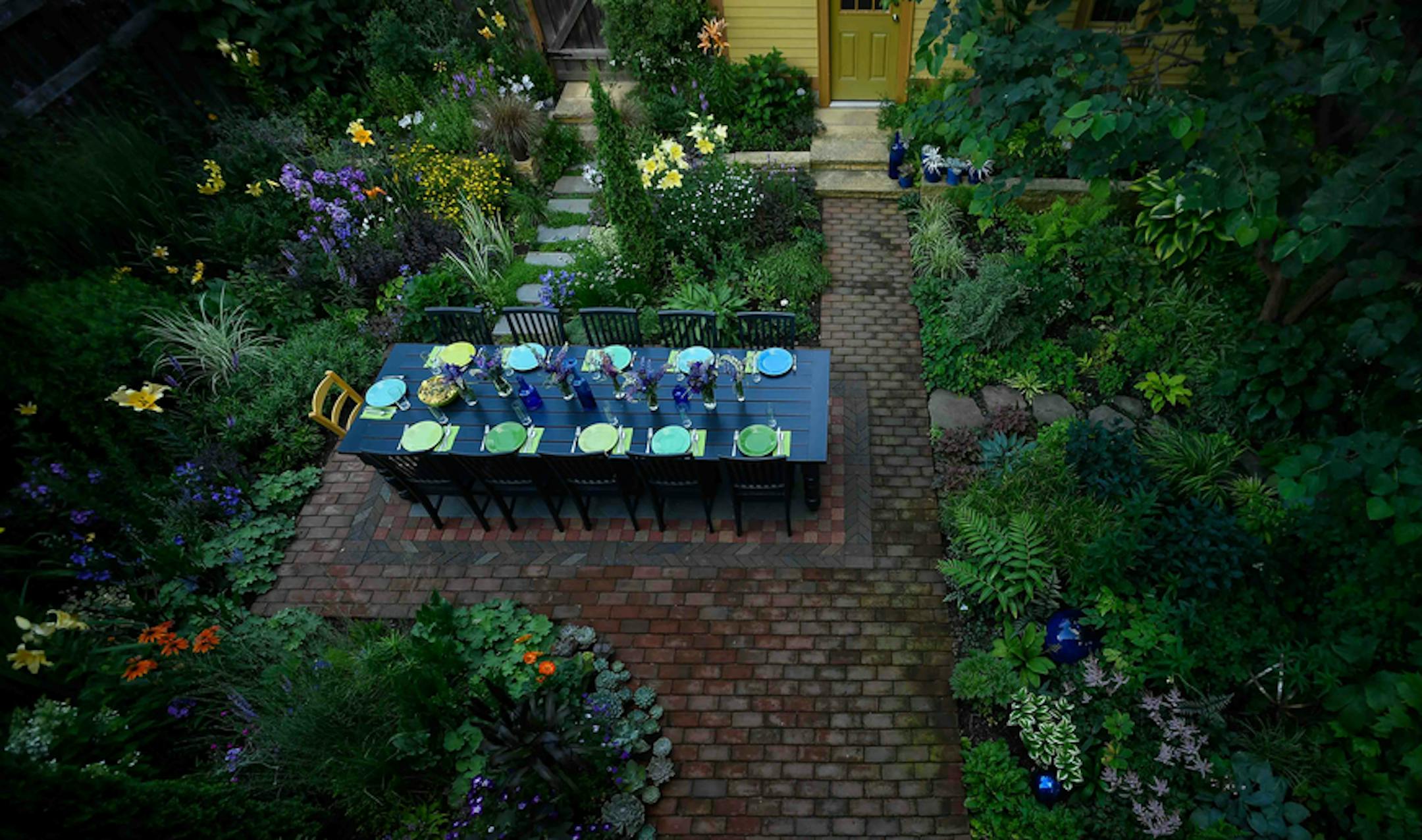 A bird's-eye view of Frank Fitzgerald's backyard before a dinner party Saturday night. ] AARON LAVINSKY • aaron.lavinsky@startribune.com Beautiful Gardens winner Frank Fitzgerald has made the most of a small city lot, creating a lush oasis for entertaining. We photograph Fitzgerald as he entertains guests at his home in Minneapolis on Saturday, July 22, 2017.