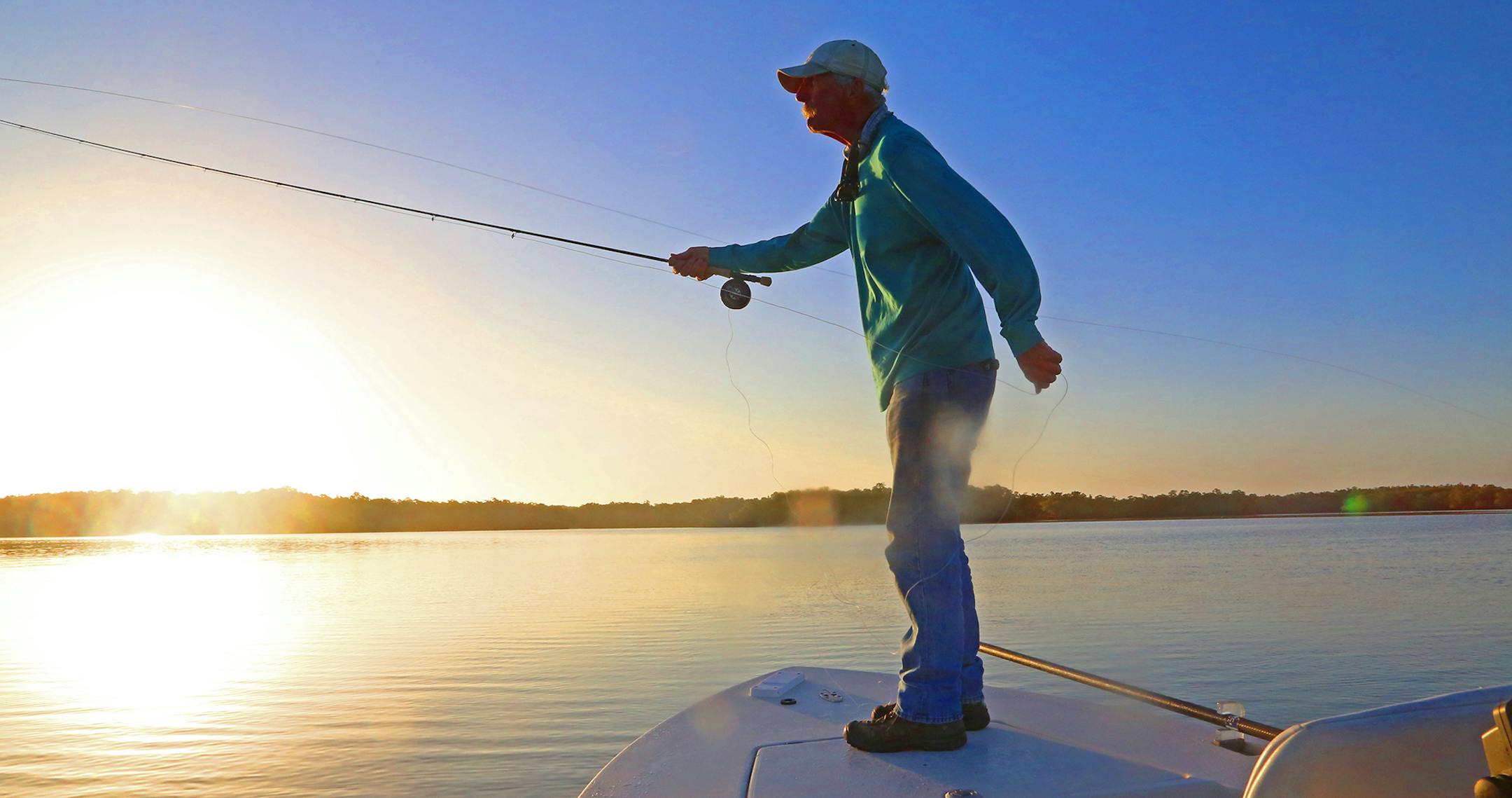 Ned Small, a fly fshing guide who lives in Everglades City, Fla., casts against the morning sun one day last week while fishing for snook and redfish.