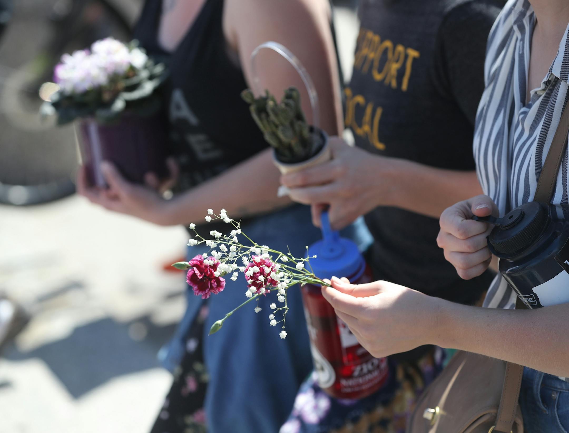 March for Science moved from the start at Cathedral Hill Park to State Capitol, with an estimated 10,000 or more joining to champion the role of science in American life. Here, some of the marchers came with flowers and plants during the March for Science near the State Capitol Mall Saturday, April 22, 2017, in St. Paul, MN.