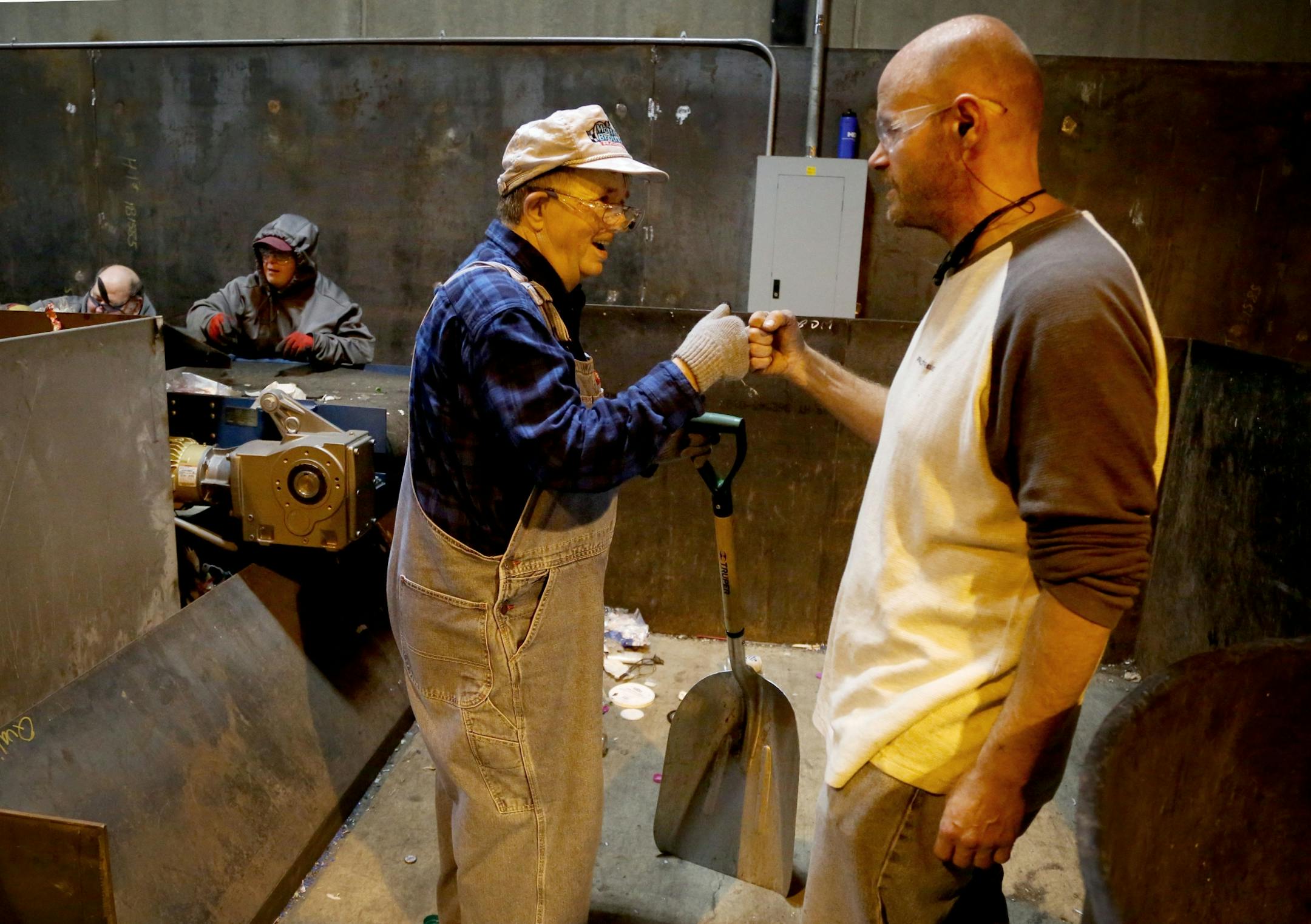Disabled workers like John Week, 37, have opportunities that they never thought possible. Workers who once toiled for years in dead-end jobs are now making up to $14 an hour at an MDI facility and have opportunities for advancement. Here, Week fists bumps an employee after praising the worker for his effort and telling the worker that he likes his overalls Tuesday, Sept. 27, 2016, in Cohasset, MN.