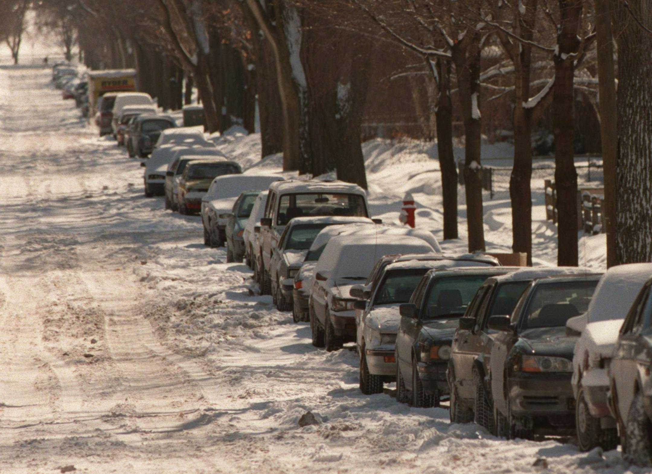 Parking on one side of the street for the winter snow ban,- cars line Emerson Av So bumper to bumper for blocks,- looking south from 31st st toward 36th st ORG XMIT: MIN2014021014184502