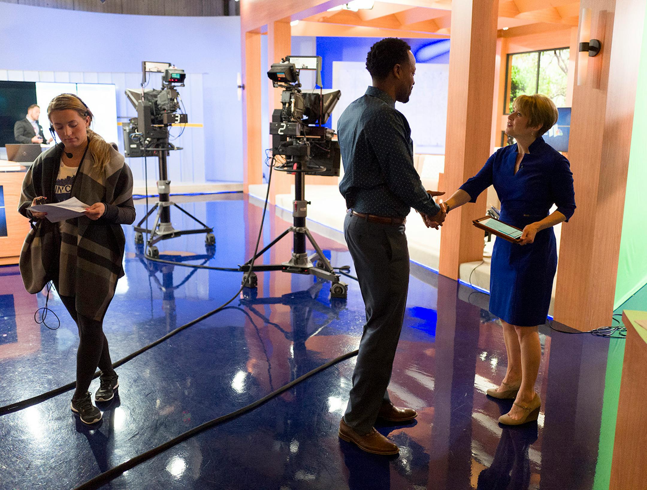 KARE 11 morning show host Kim Insley, right, shook hands with Best Academy language arts teacher Abdul Wright at the KARE studio on Monday, the day after he won the 2016 Minnesota Teacher of the Year award.