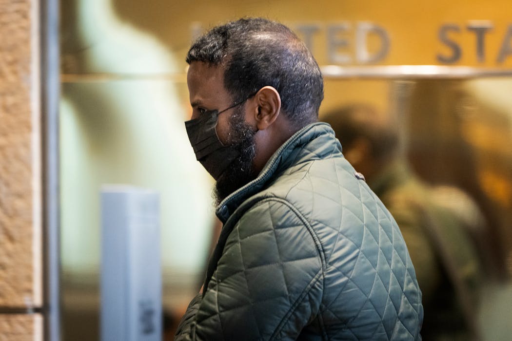 Defendant Abdiaziz Shafii Farah walks into U.S. District Court on April 24, the third day of jury selection in the first Feeding Our Future case to go to trial. 