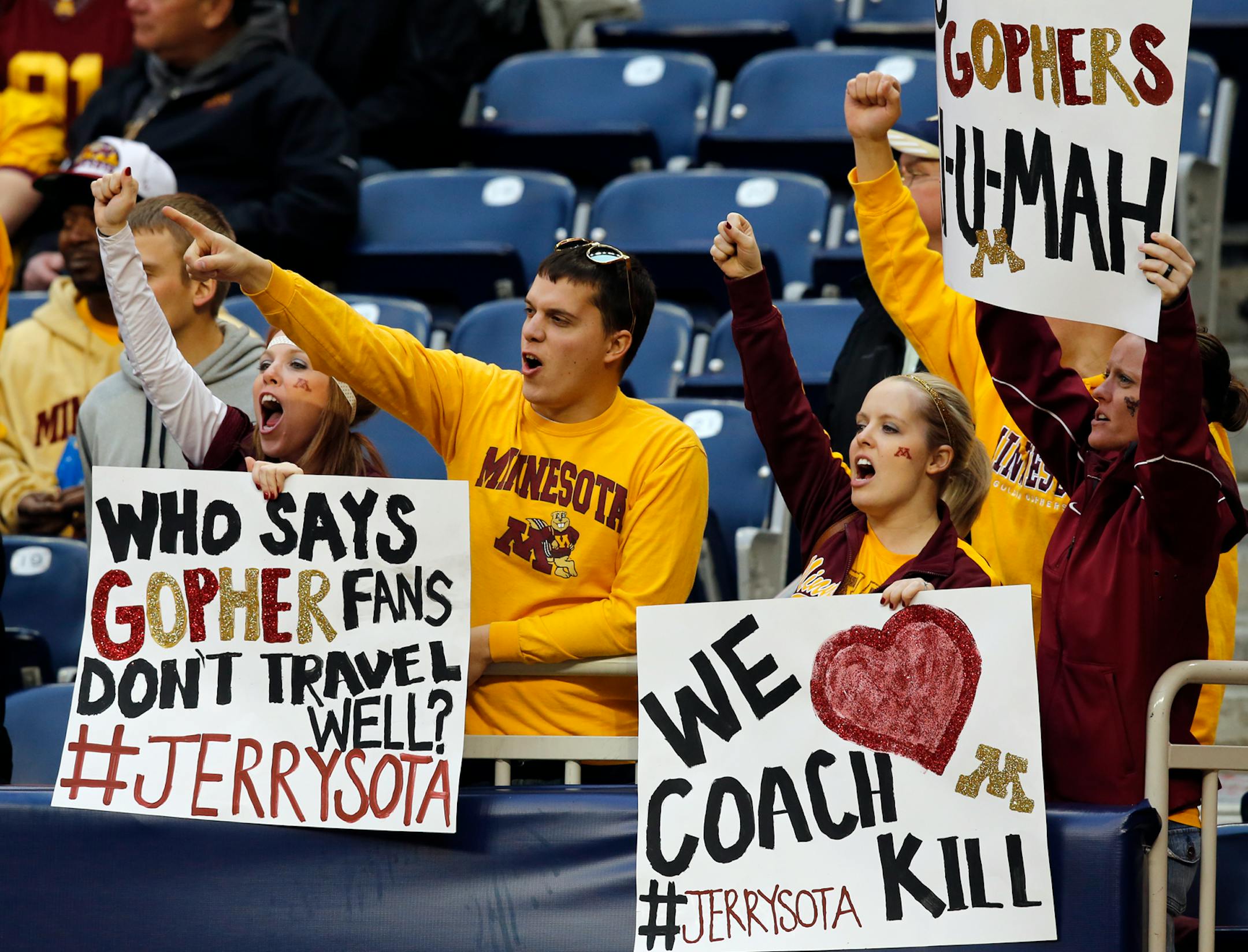 Gophers fans in the stands get into the swing of things at the Texas Bowl