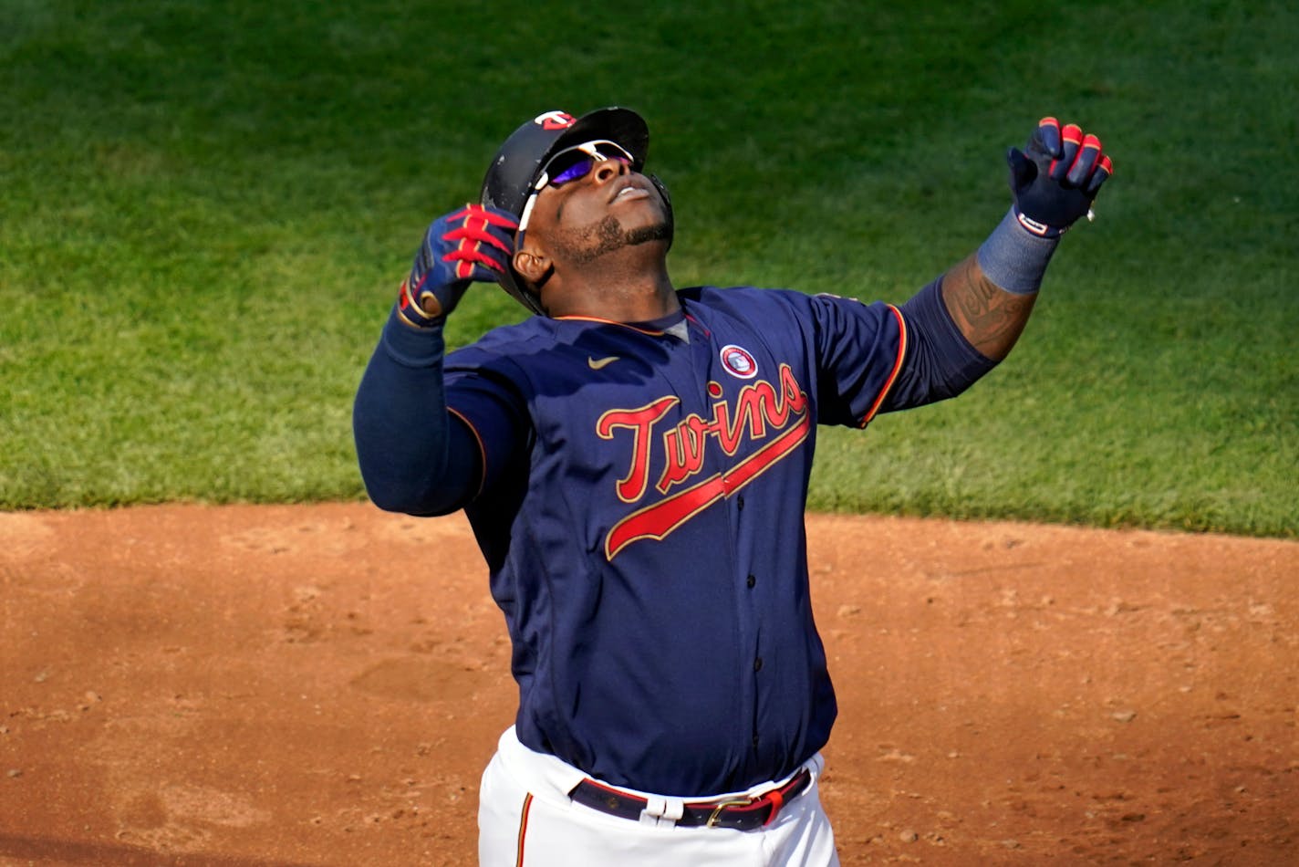 Minnesota Twins' Miguel Sano celebrates his three-run home run off Oakland Athletics pitcher Jake Diekman in the eighth inning of a baseball game, Saturday, May 15, 2021, in Minneapolis. (AP Photo/Jim Mone)