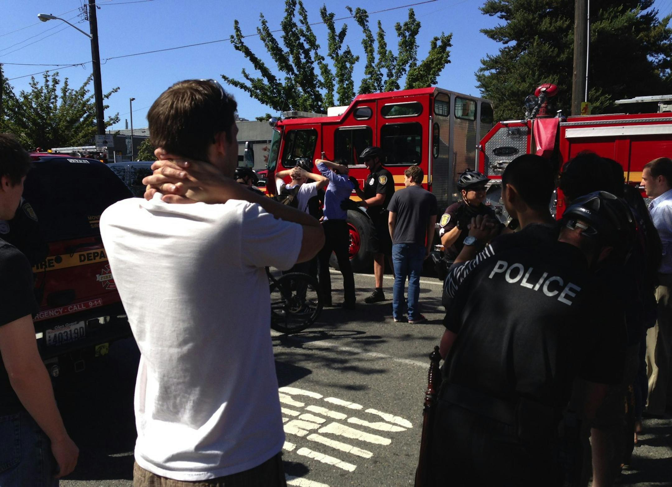 Emergency personnel arrive on the scene near a shooting on the Seattle Pacific University campus Thursday, June 5, 2014, in Seattle. The university posted online Thursday that "the campus is in lockdown due to a shooting near Otto Miller Hall. (AP Photo/The Seattle Times, Dean Rutz) SEATTLE OUT; USA TODAY OUT; MAGS OUT; TELEVISION OUT; NO SALES; MANDATORY CREDIT TO BOTH THE SEATTLE TIMES AND THE PHOTOGRAPHER