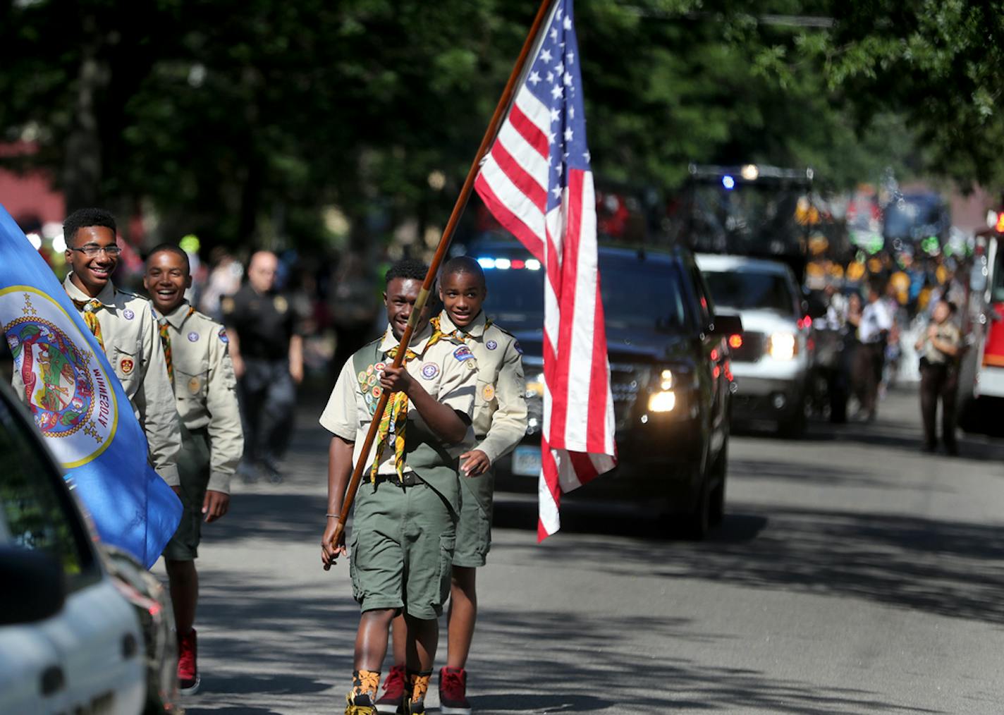 Members of the Pilgrim Baptist Church Troop 61 Boy Scouts led the flag ceremony at the start of the Rondo Days Parade in St. Paul.