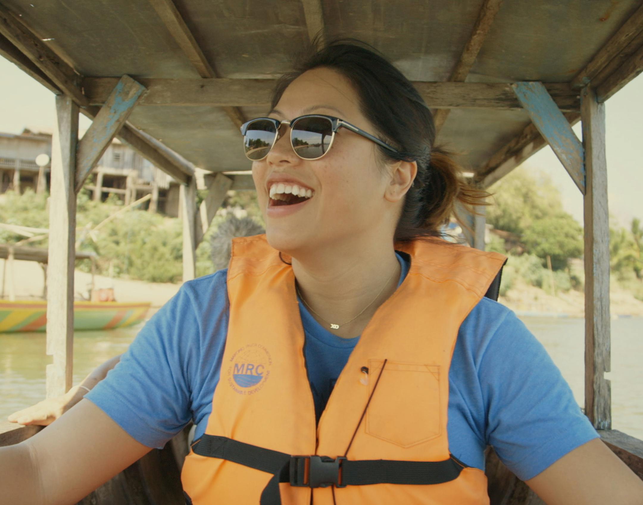 Kulap Vilaysack traveling down the Mekong River. Photo by Jonathan Nicholas