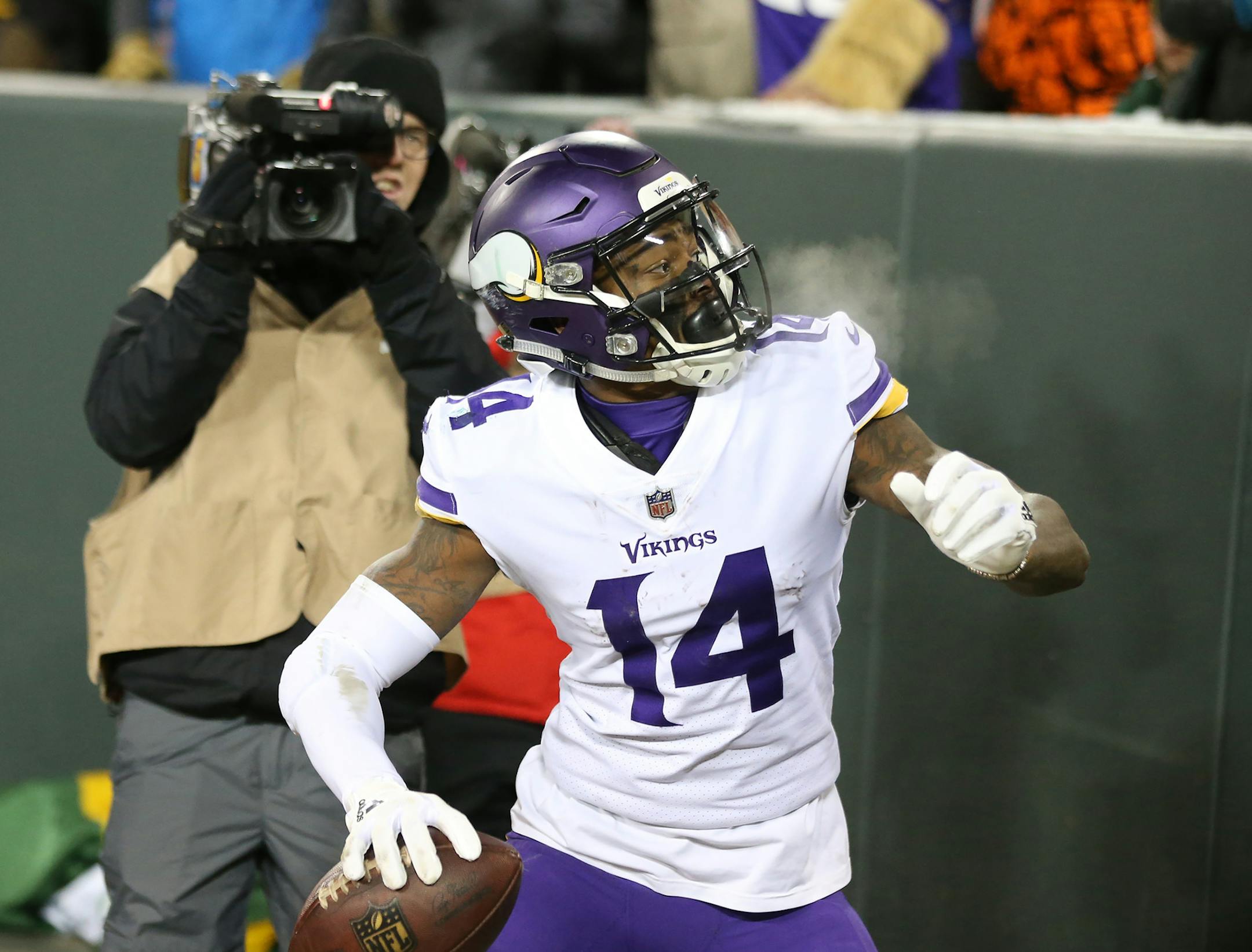 Minnesota Vikings wide receiver Stefon Diggs (14) threw the ball in the stands after catching the first touchdown of the game at Lambeau Field Saturday December 23, 2017 in Green Bay, WI.] JERRY HOLT &#xef; jerry.holt@startribune.com