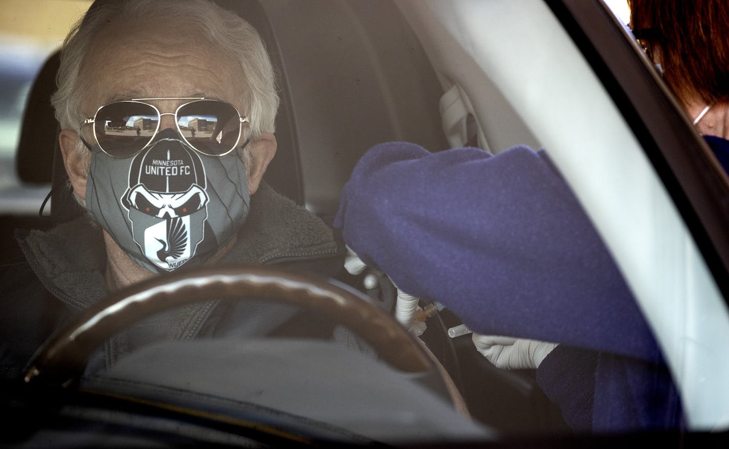 Jim House got a flu shot in a drive-up tent in the parking lot of Park Nicollet Clinic Plymouth on Thursday.