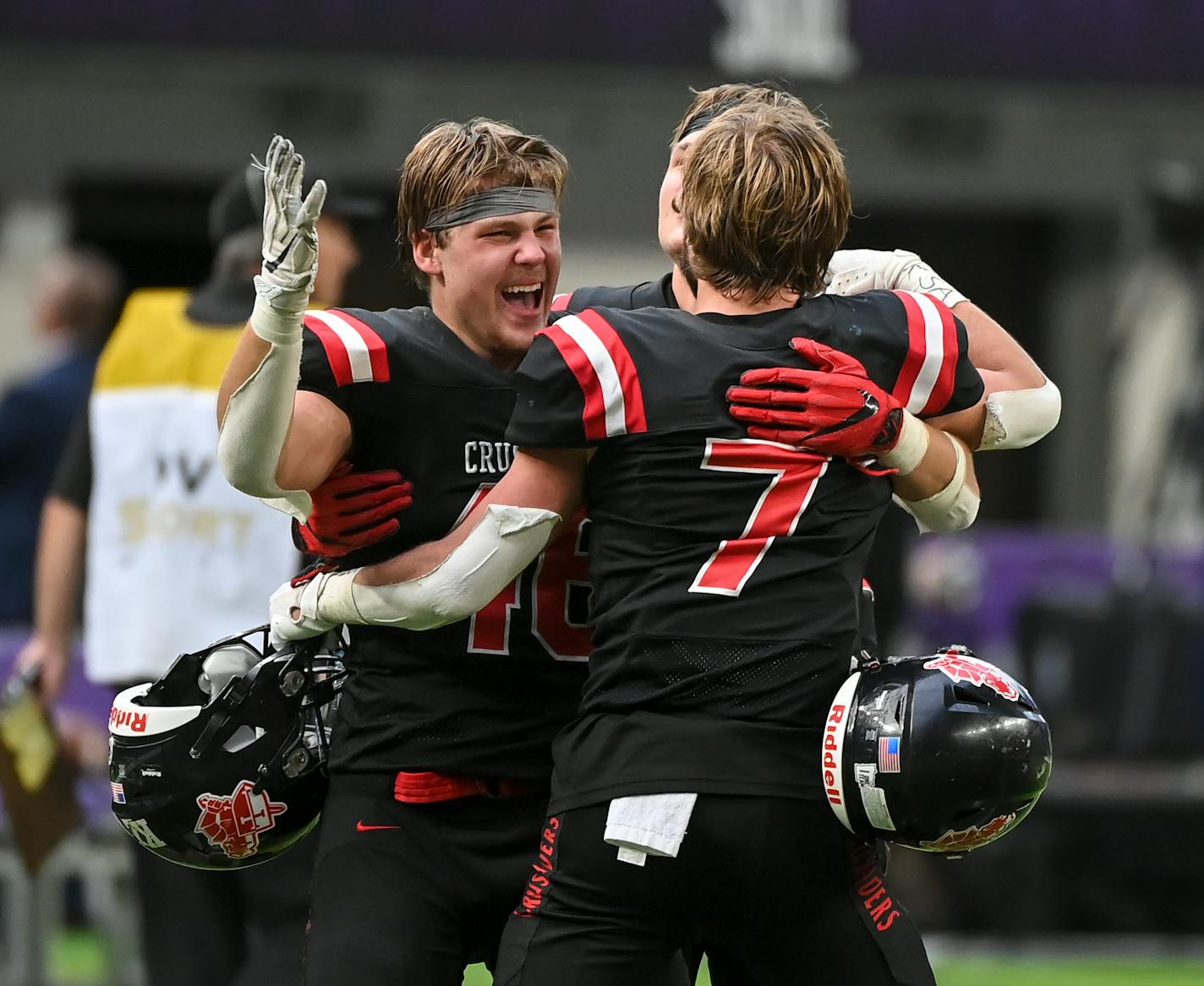 Mayer Lutheran Tyler Neitzel (46), running back Elijah Jopp (7) and fullback Cole Neitzel (86) celebrate their win in the Class 1A state championship football game between Minneota and Mayer Lutheran Friday, Nov. 26, 2021 at U.S. Bank Stadium in Minneapolis, Minn. ] AARON LAVINSKY • aaron.lavinsky@startribune.com