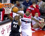 Washington Wizards power forward Andray Blatche (7) blocks the shot os Minnesota Timberwolves power forward Anthony Tolliver (44) during the second ha